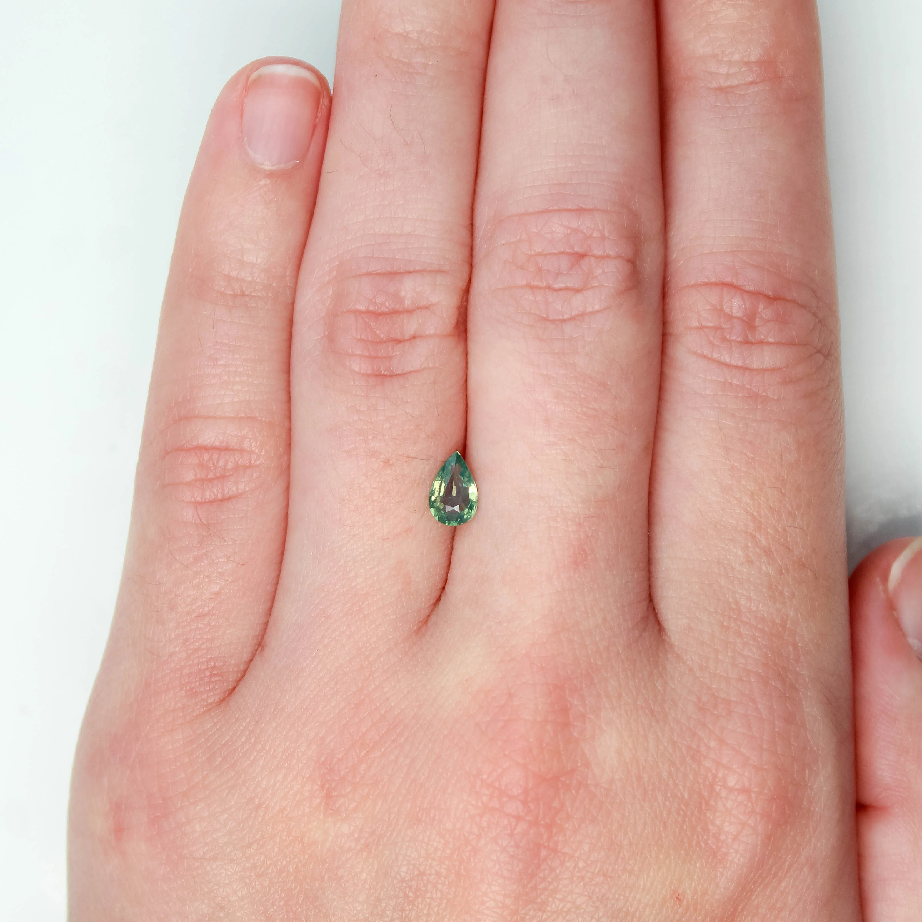 0.62 Carat Light Green Pear Sapphire for Custom Work - Inventory Code LGPS062 - Image 2