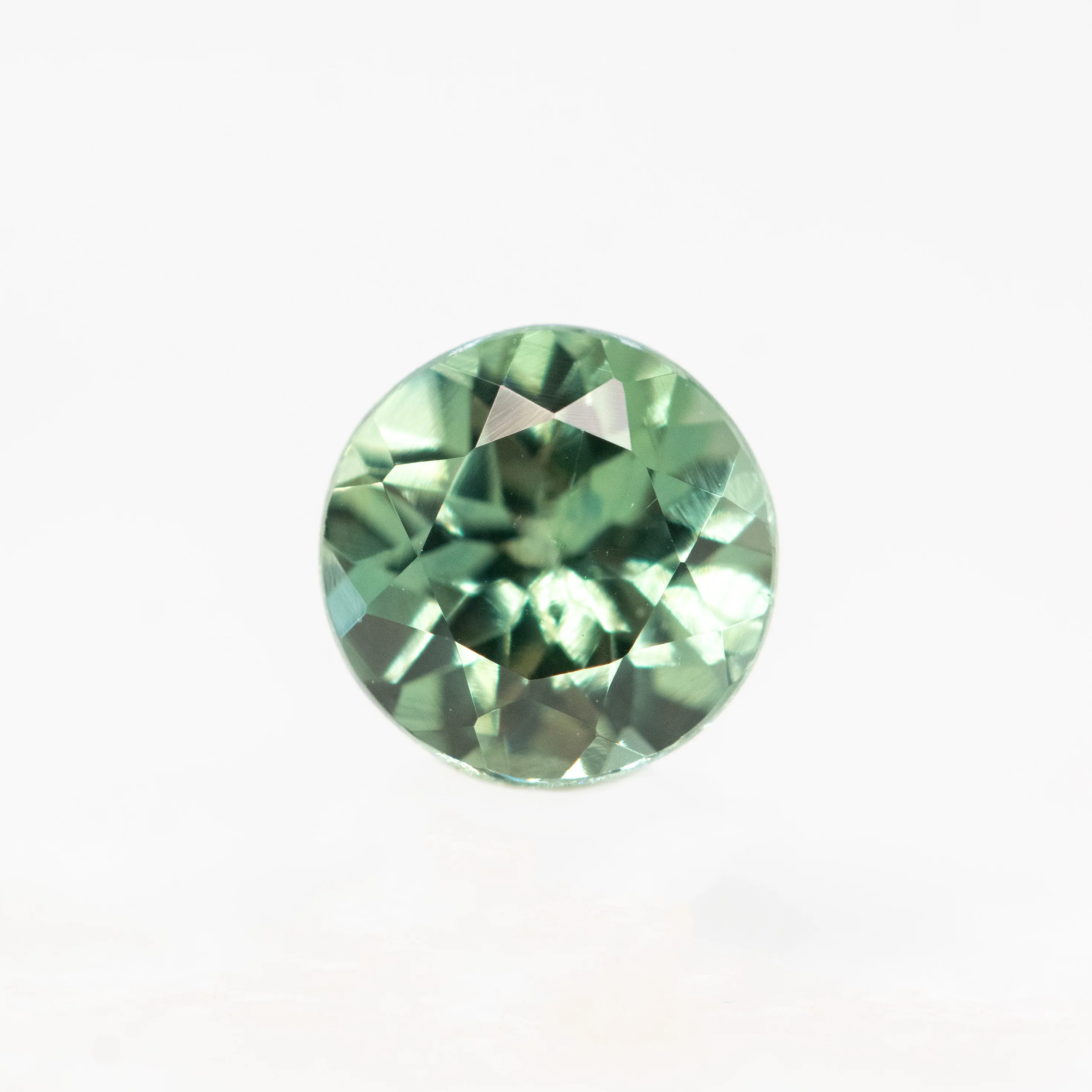 0.72 Carat Round Green Montana Sapphire for Custom Work - Inventory Code TGRS072