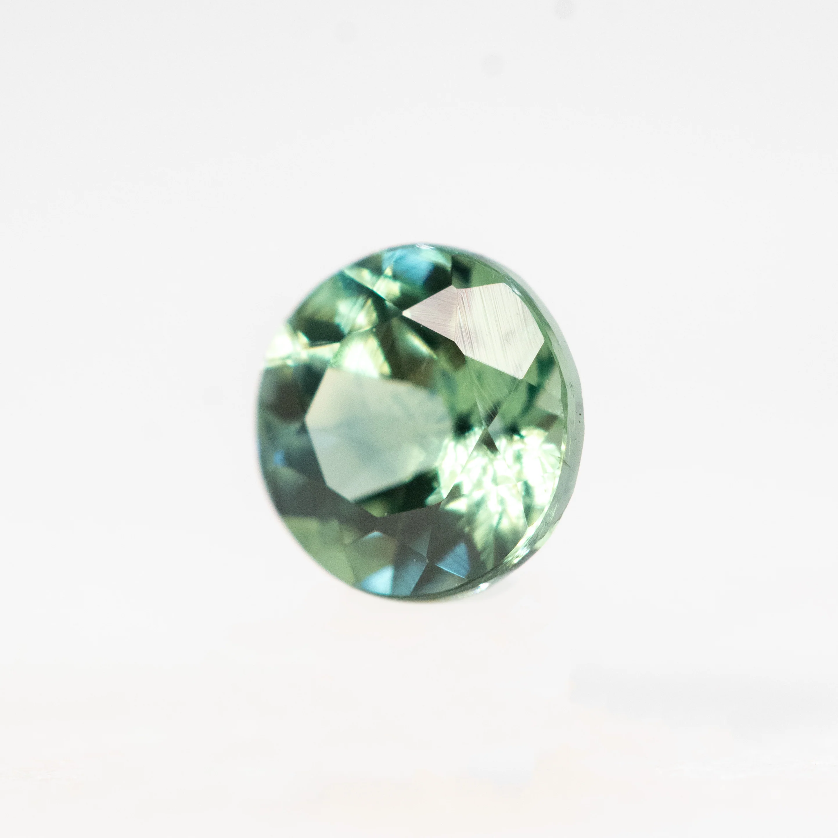 0.72 Carat Round Green Montana Sapphire for Custom Work - Inventory Code TGRS072 - Image 3