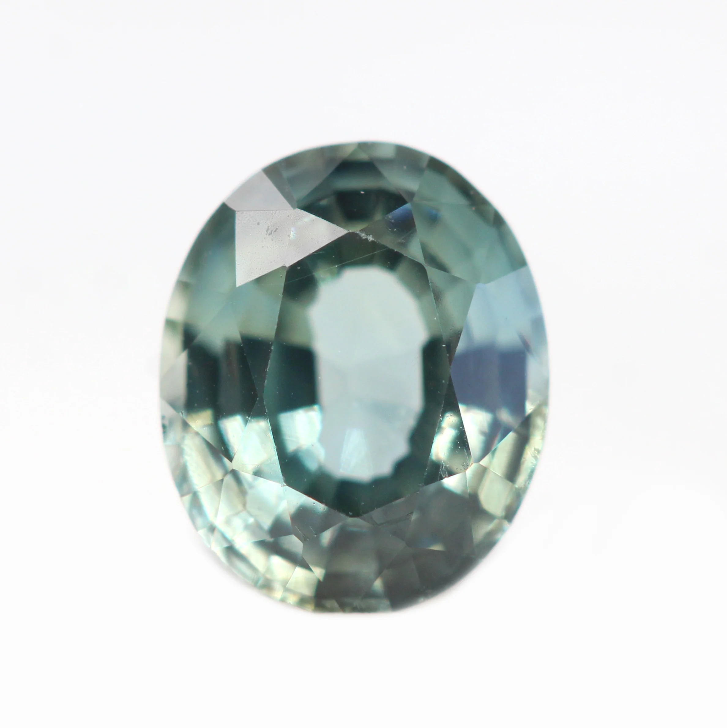0.81 Carat Light Teal Oval Sapphire for Custom Work - Inventory Code TOS081