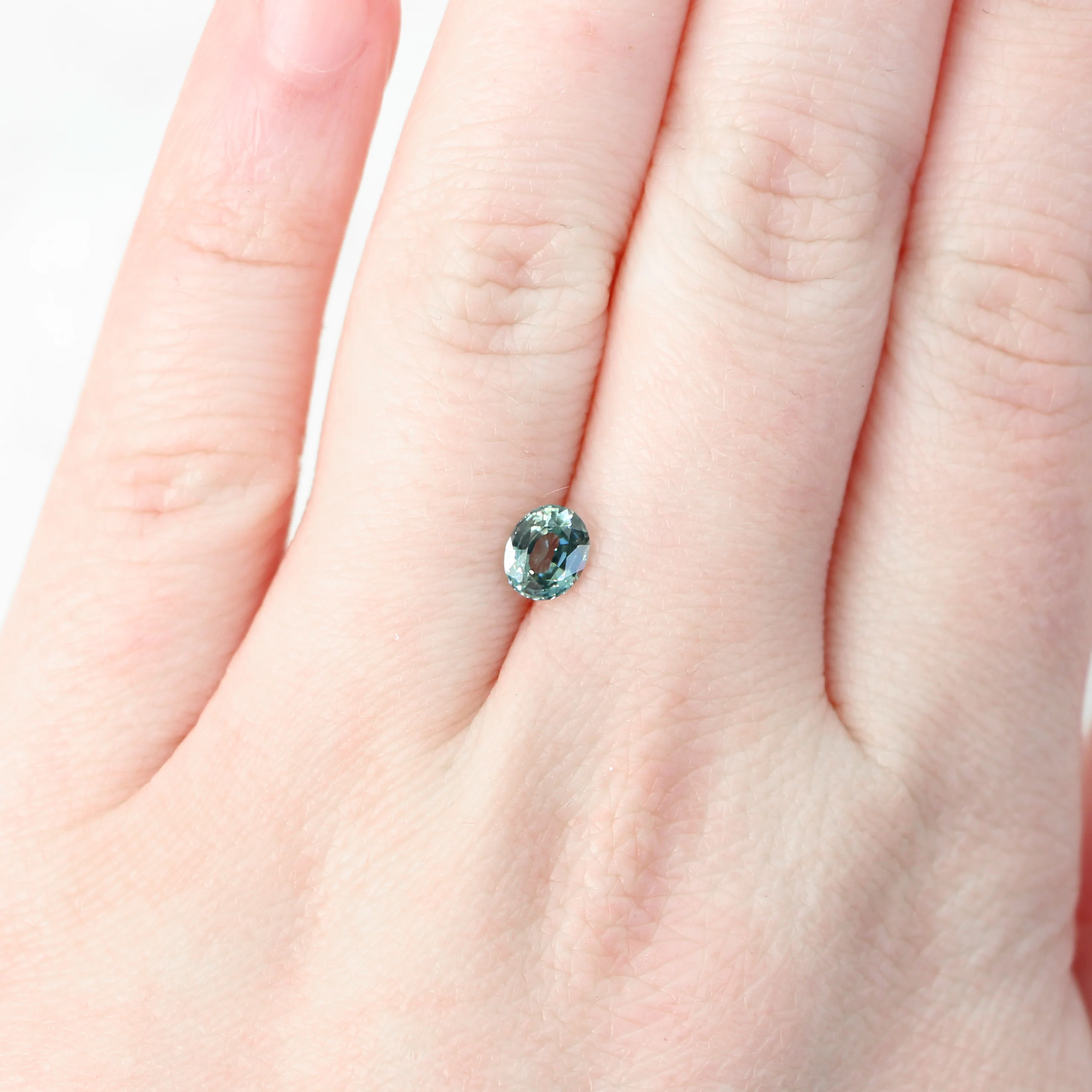 0.81 Carat Light Teal Oval Sapphire for Custom Work - Inventory Code TOS081 - Image 2
