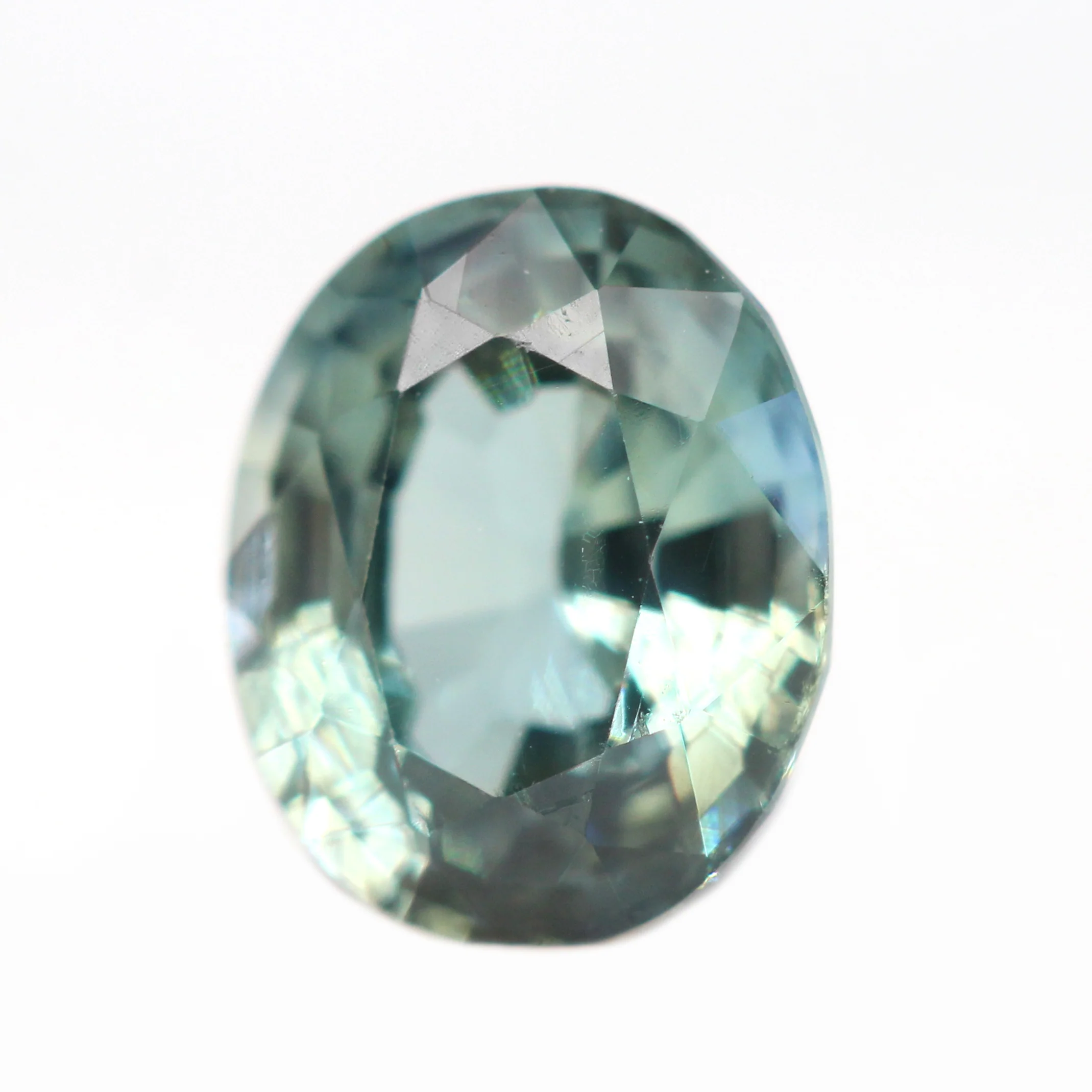 0.81 Carat Light Teal Oval Sapphire for Custom Work - Inventory Code TOS081 - Image 3