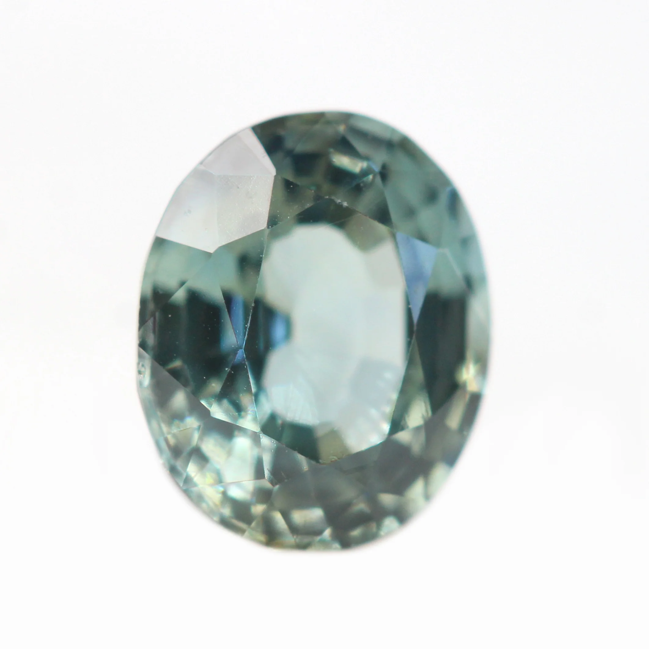 0.81 Carat Light Teal Oval Sapphire for Custom Work - Inventory Code TOS081 - Image 4