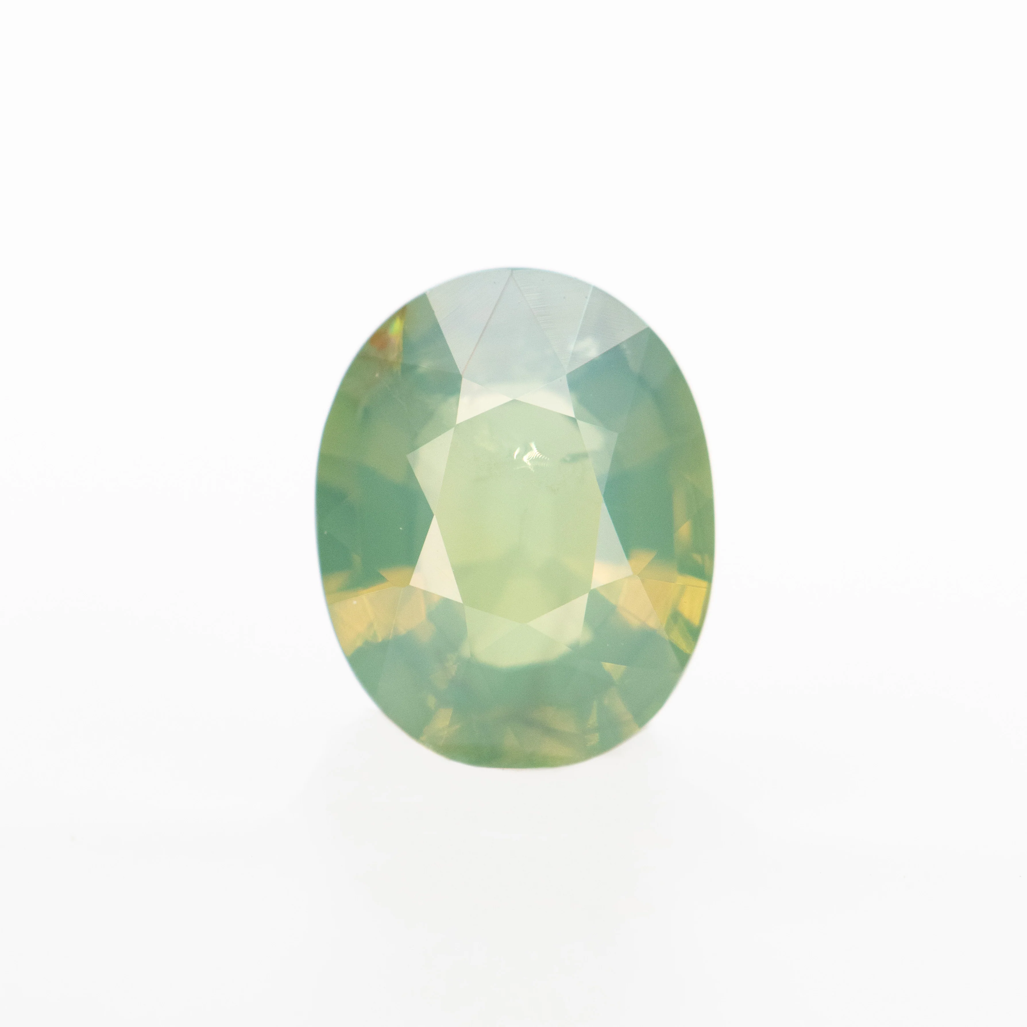 0.92 Carat Opalescent Yellow-Green Oval Sapphire for Custom Work - Inventory Code YGOS092