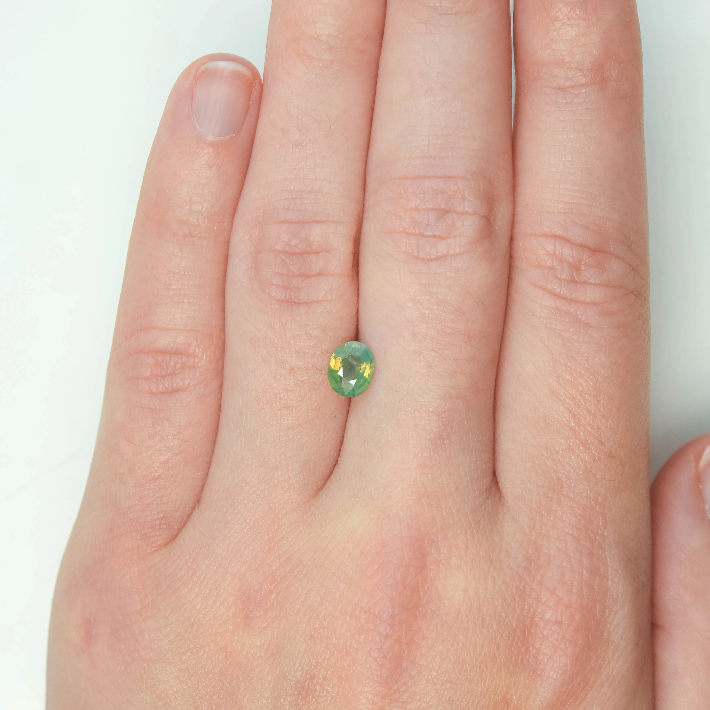 0.92 Carat Opalescent Yellow-Green Oval Sapphire for Custom Work - Inventory Code YGOS092 - Image 2
