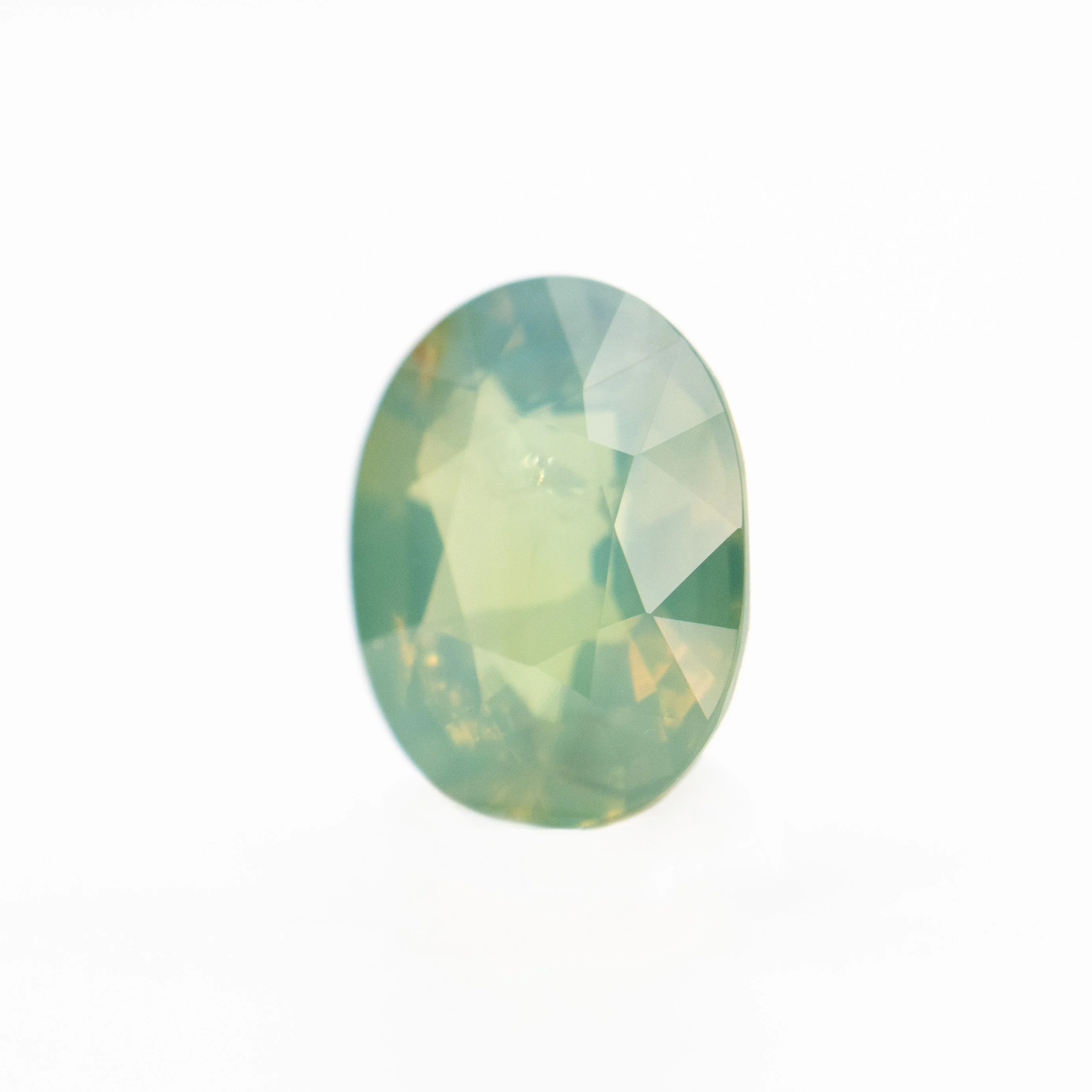 0.92 Carat Opalescent Yellow-Green Oval Sapphire for Custom Work - Inventory Code YGOS092 - Image 3