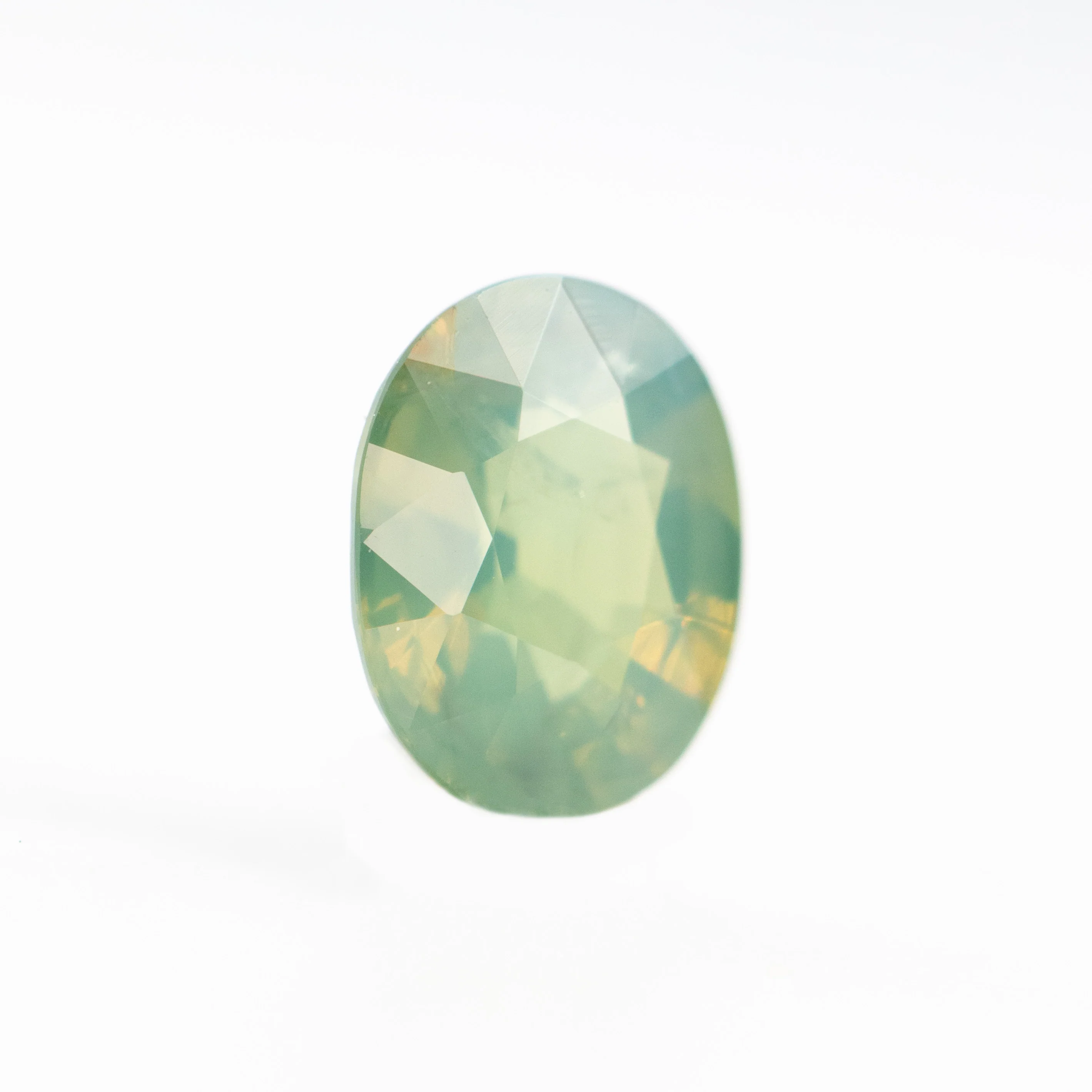 0.92 Carat Opalescent Yellow-Green Oval Sapphire for Custom Work - Inventory Code YGOS092 - Image 4