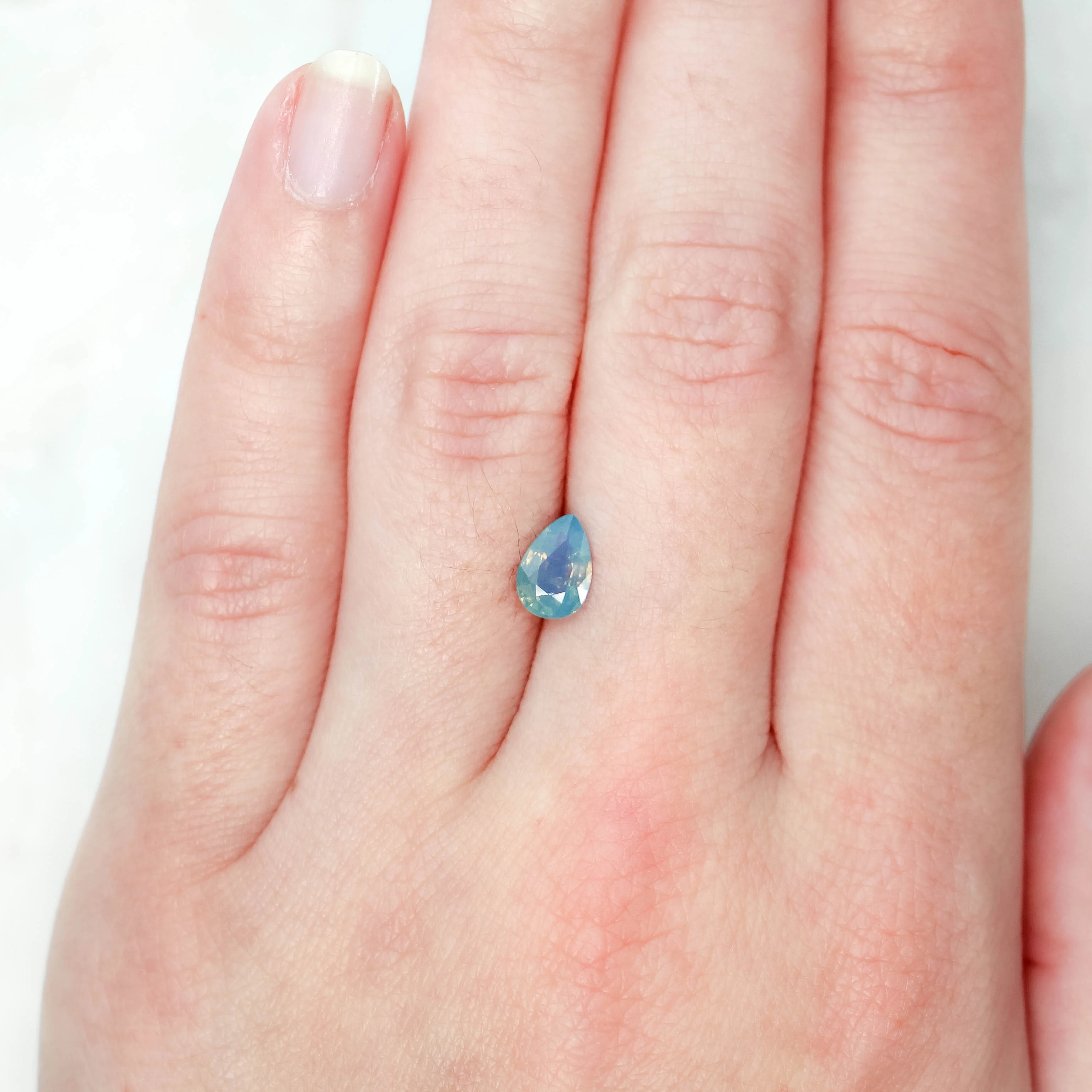 1.09 Carat Opalescent Blue Pear Sapphire for Custom Work - Inventory Code LBPS109 - Image 2