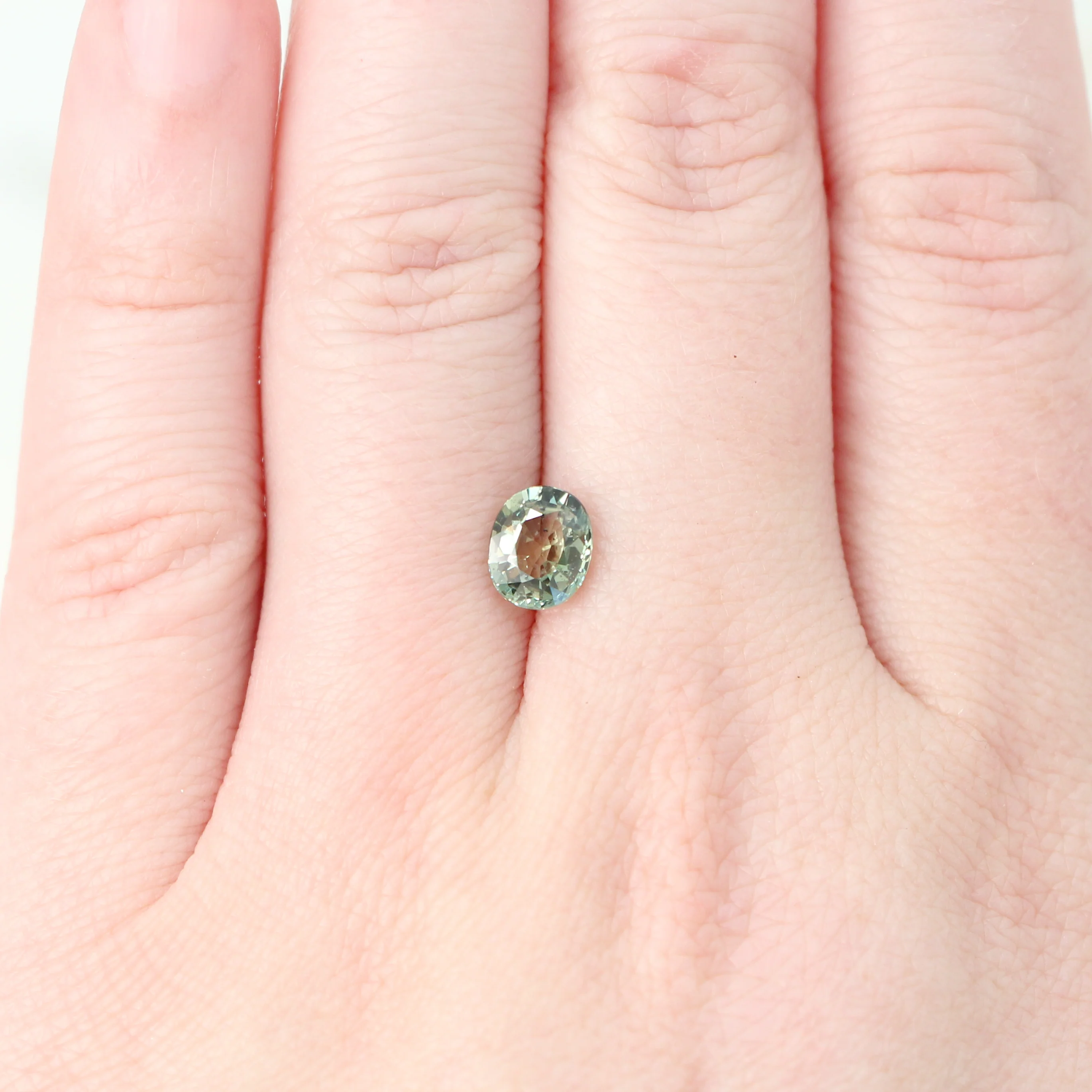 1.44 Carat Light Green Oval Sapphire for Custom Work - Inventory Code GOS144 - Image 2