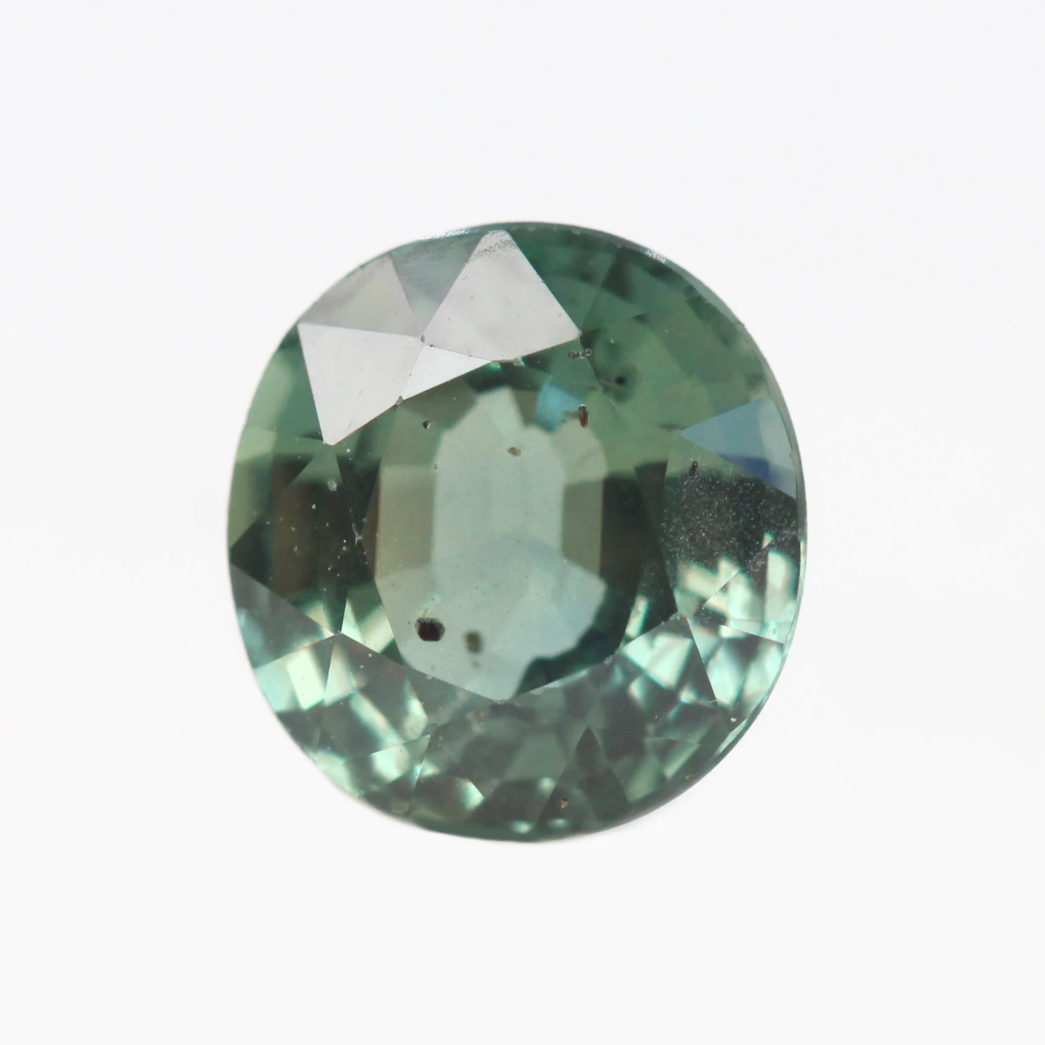 1.49 Carat Teal Green Oval Sapphire for Custom Work - Inventory Code GTOS149