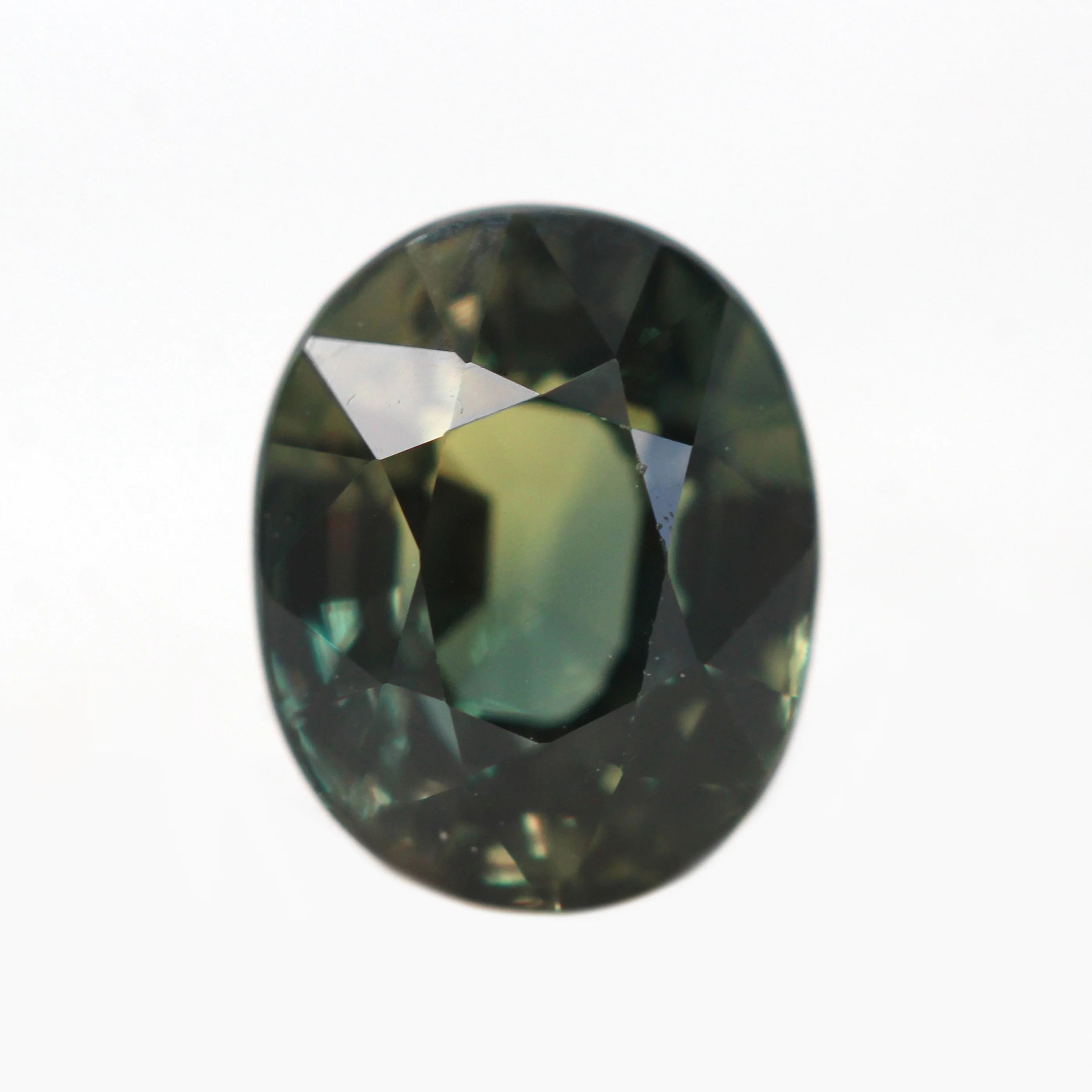 1.71 Carat Color Change Green + Brown Oval Sapphire for Custom Work - Inventory Code GBOS171