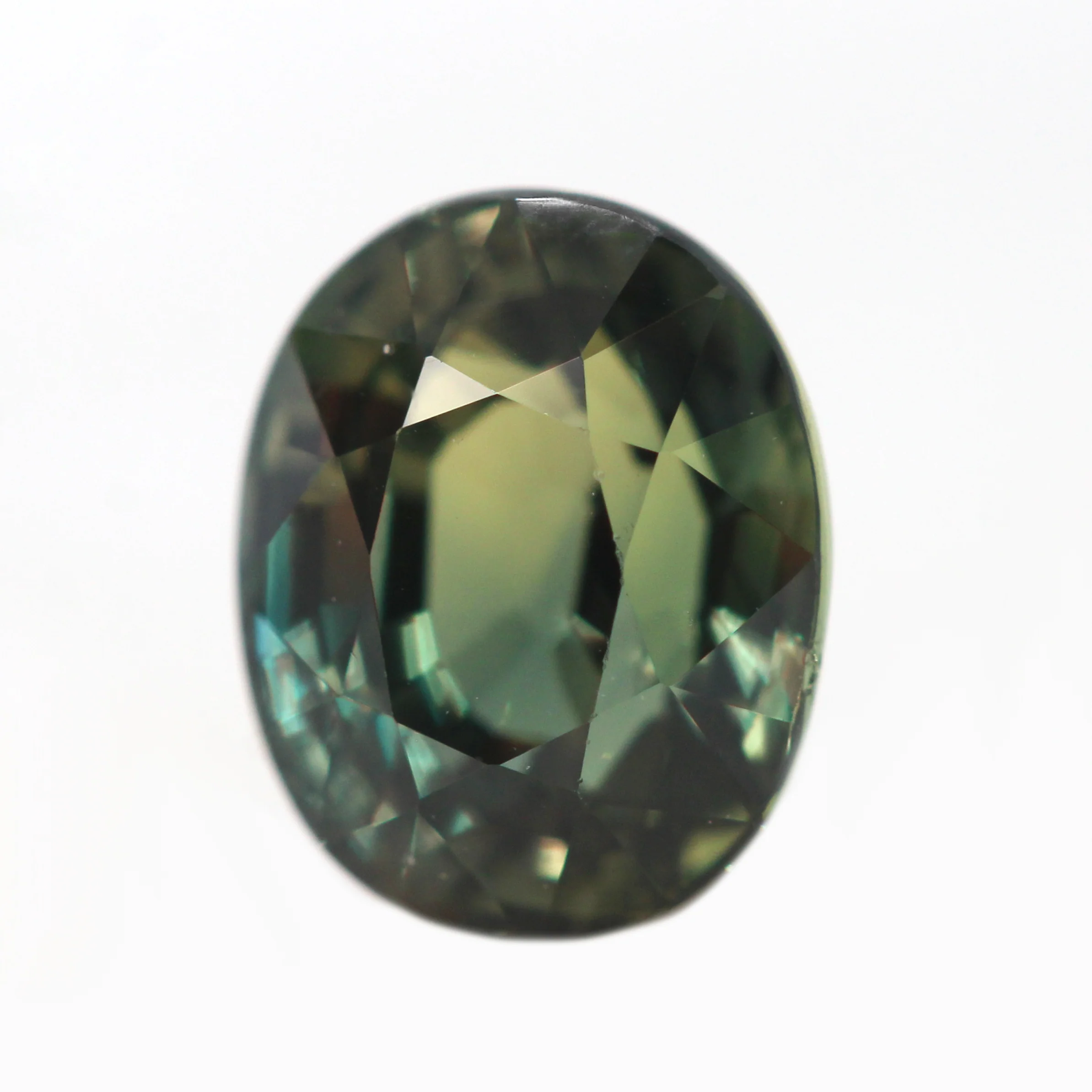 1.71 Carat Color Change Green + Brown Oval Sapphire for Custom Work - Inventory Code GBOS171 - Image 4