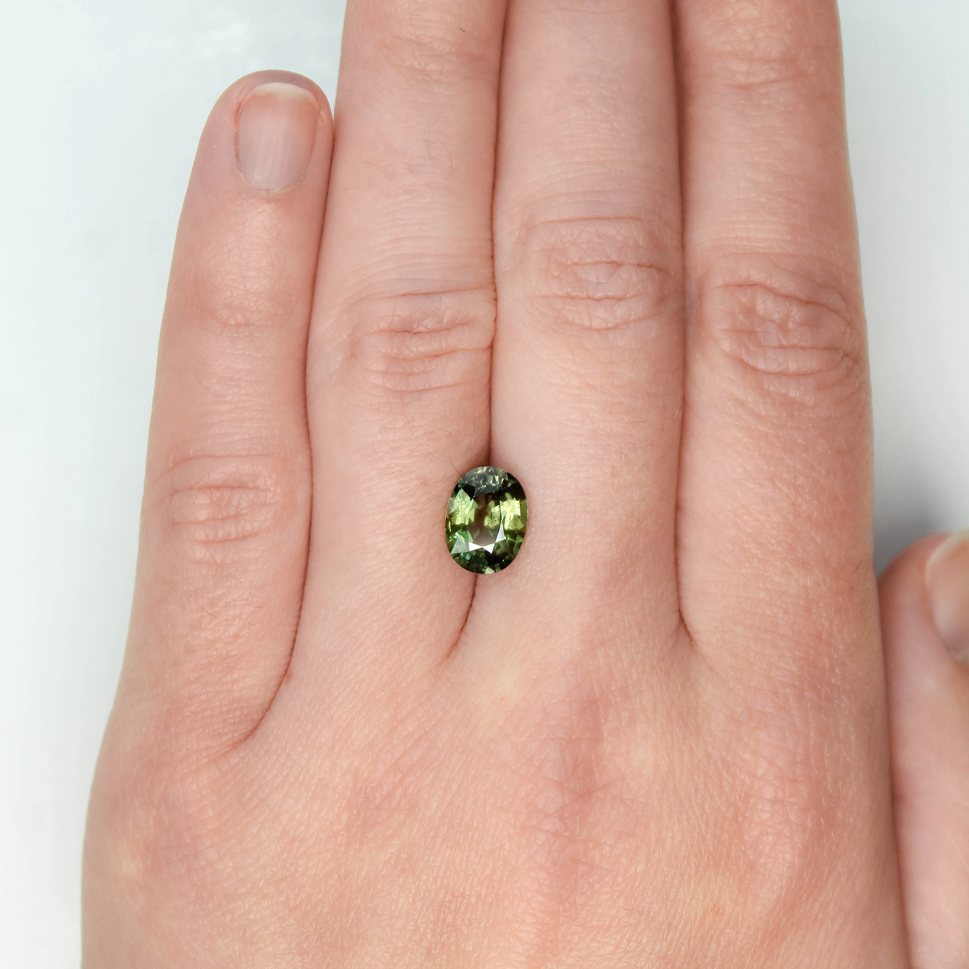 2.86 Carat Warm Green Oval Sapphire for Custom Work - Inventory Code GOS286 - Image 2