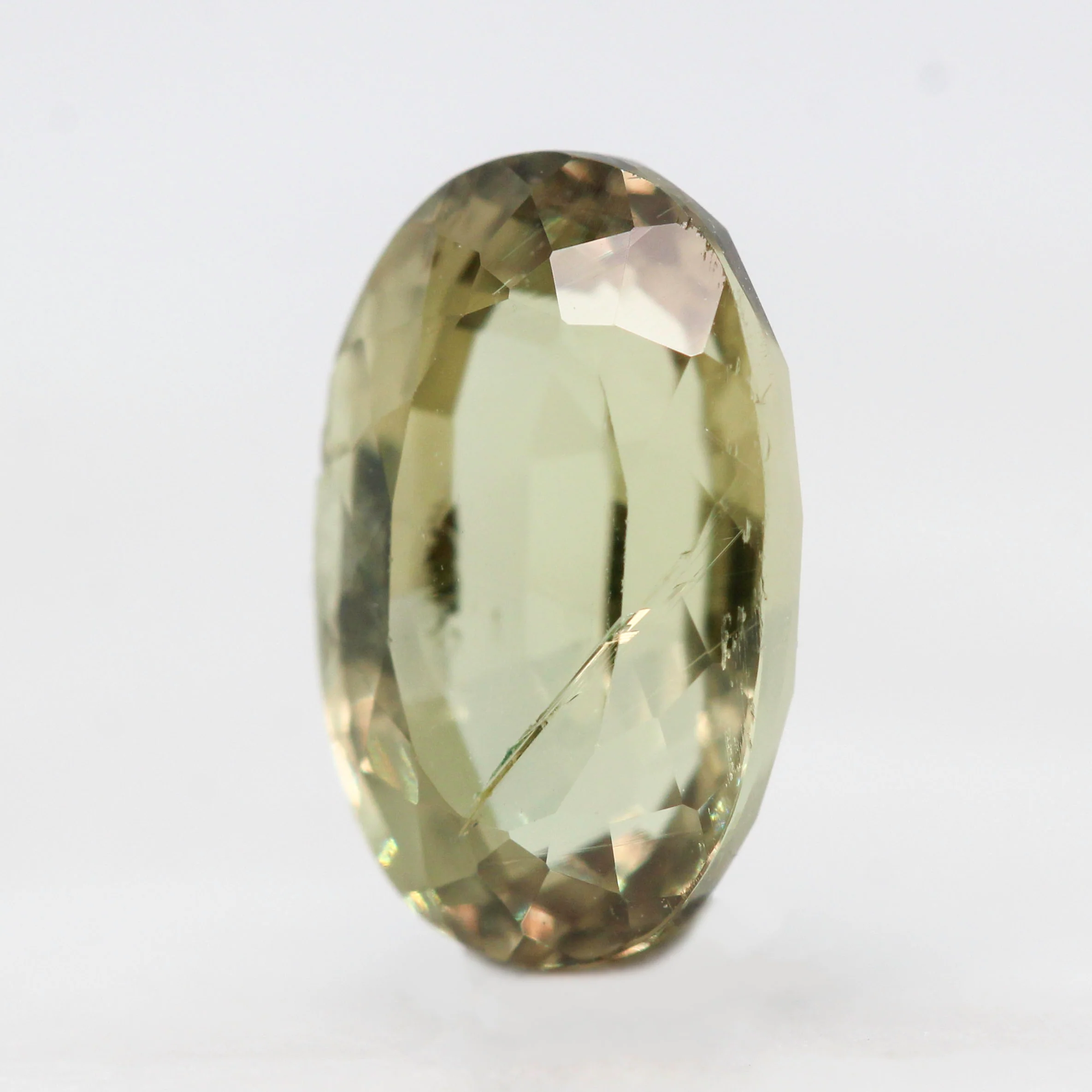 3.40 Carat Yellow-Green Oval Sapphire for Custom Work - Inventory Code YGOS340 - Image 3