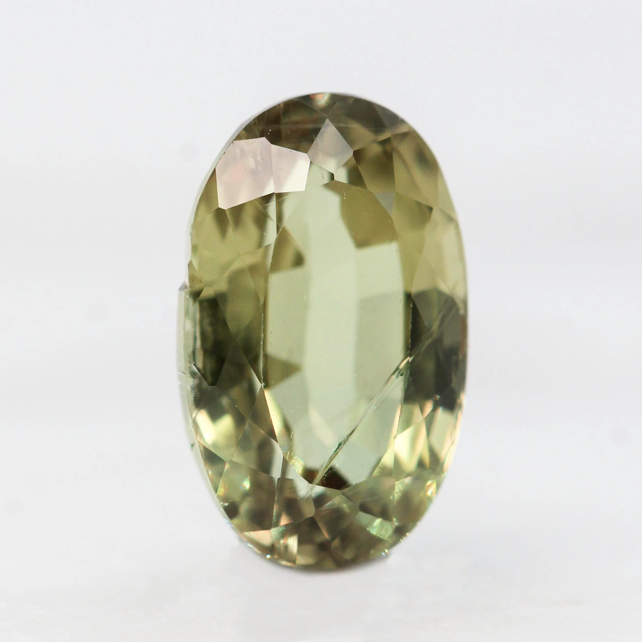 3.40 Carat Yellow-Green Oval Sapphire for Custom Work - Inventory Code YGOS340 - Image 4