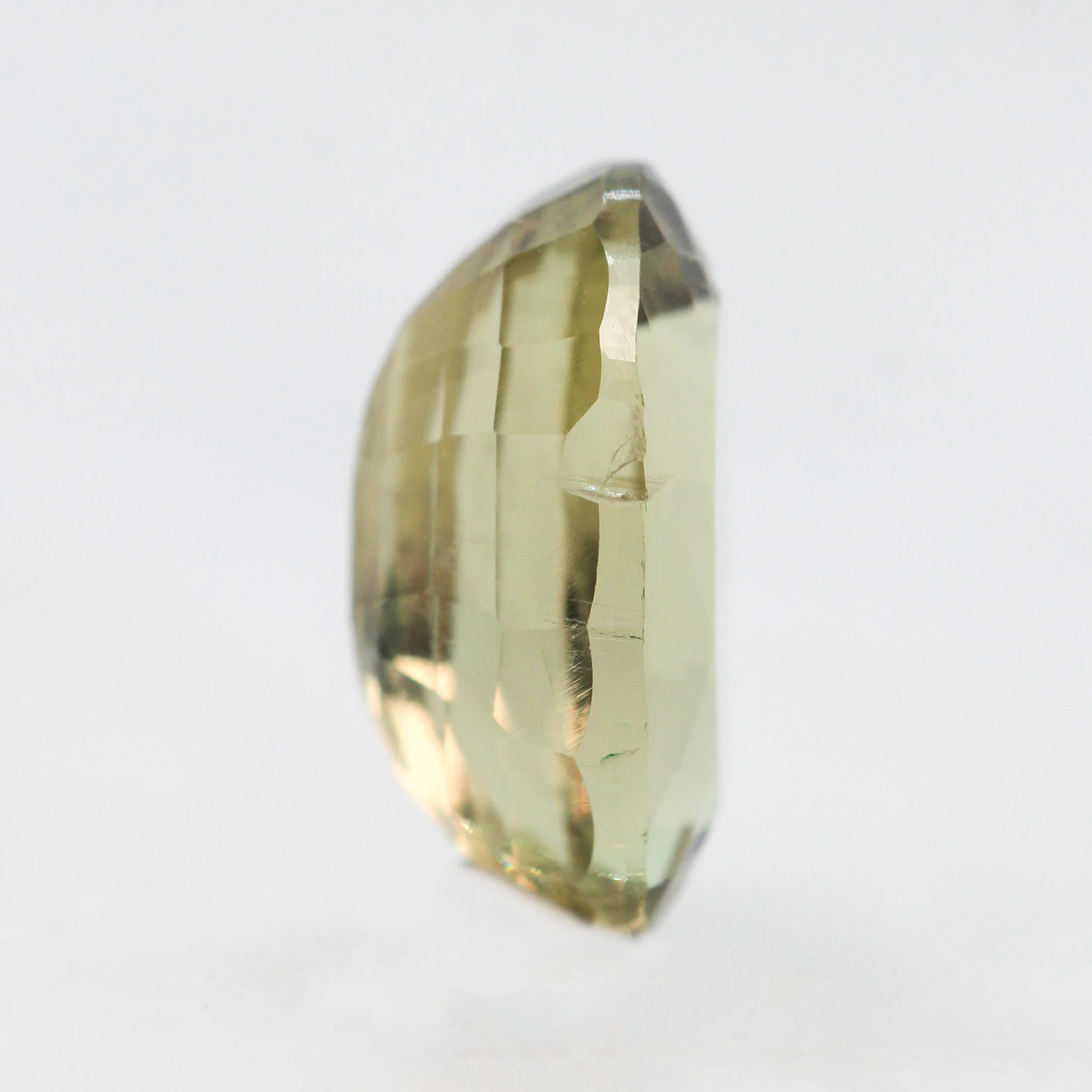 3.40 Carat Yellow-Green Oval Sapphire for Custom Work - Inventory Code YGOS340 - Image 5