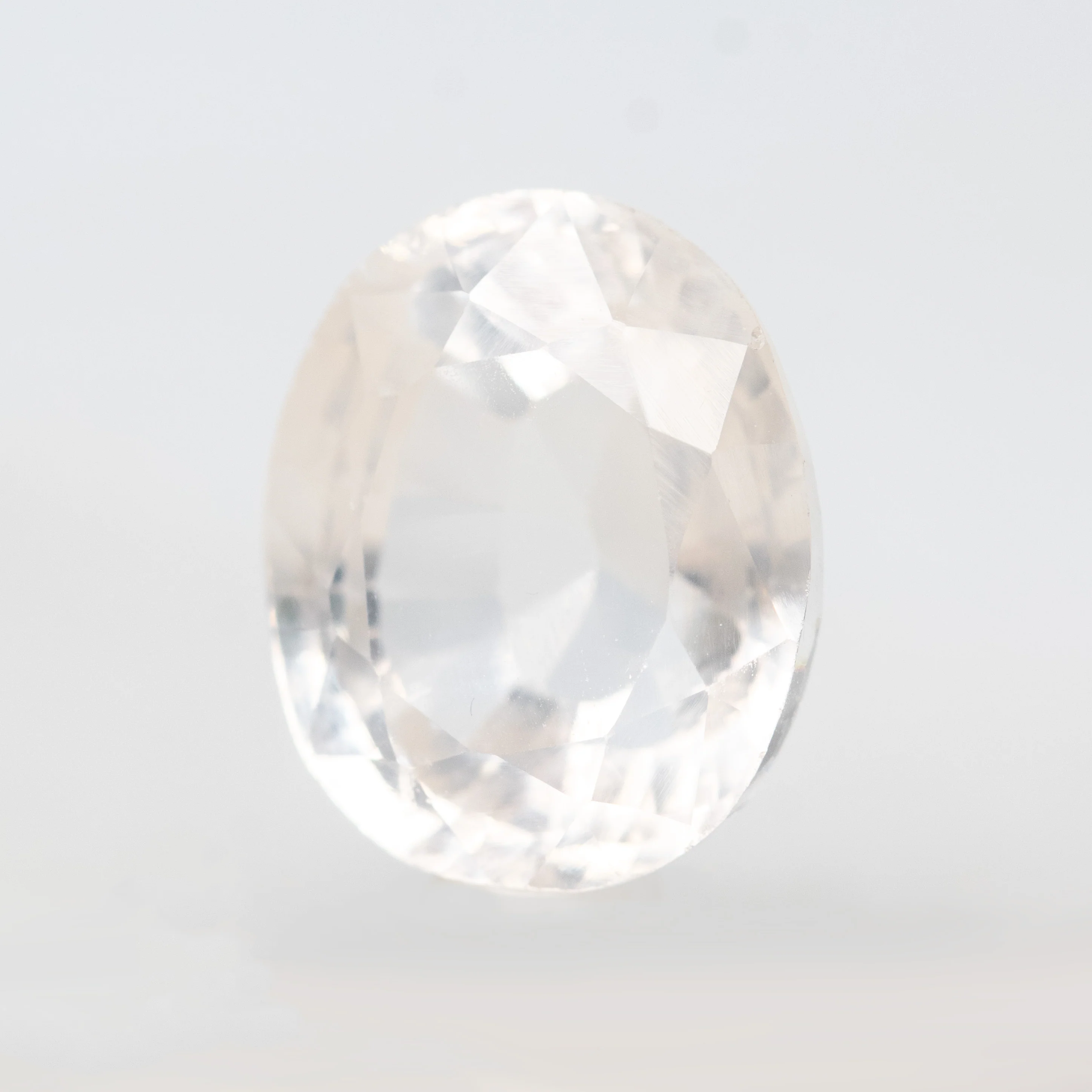 7.28 Carat Clear Oval Lab Grown Sapphire for Custom Work - Inventory Code COS728 - Image 3
