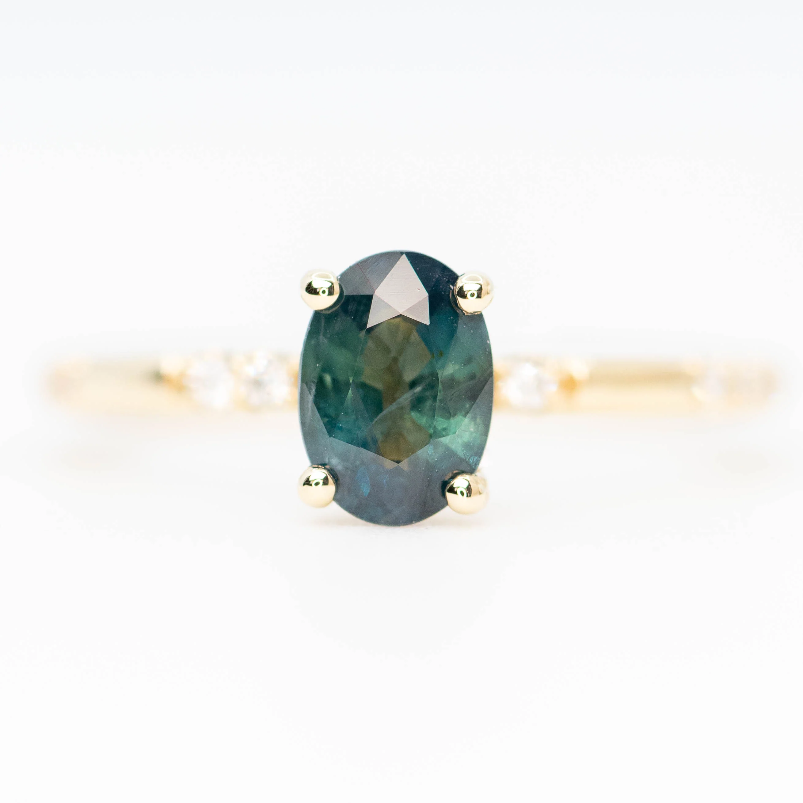 Estelle Ring with a 1.03 Carat Teal Oval Sapphire and White Accent Diamonds in 14k Yellow Gold - Ready to Size and Ship