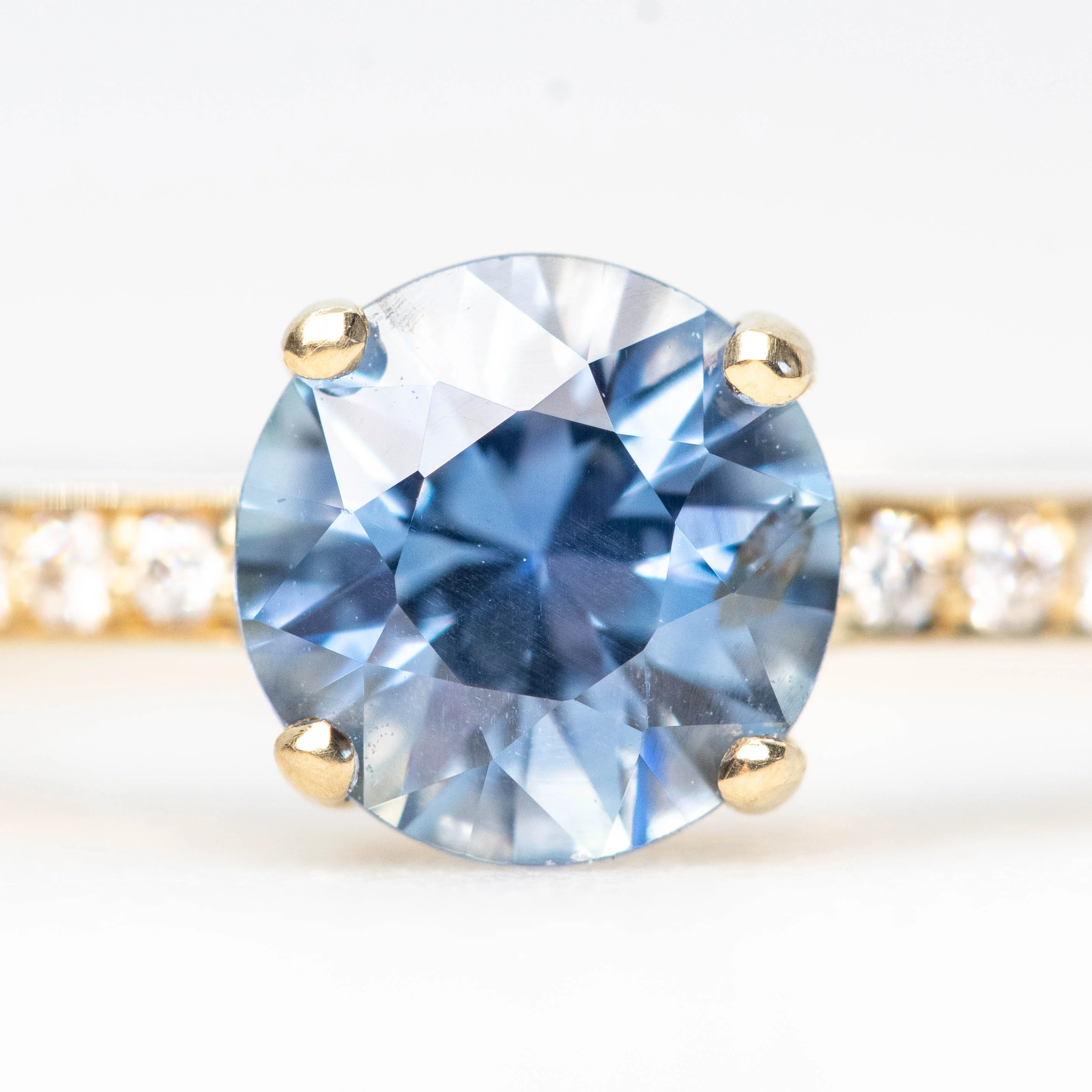 Imani Ring with a 0.96 Carat Round Blue Sapphire and White Accent Diamonds in 14k Yellow Gold - Ready to Size and Ship - Image 7
