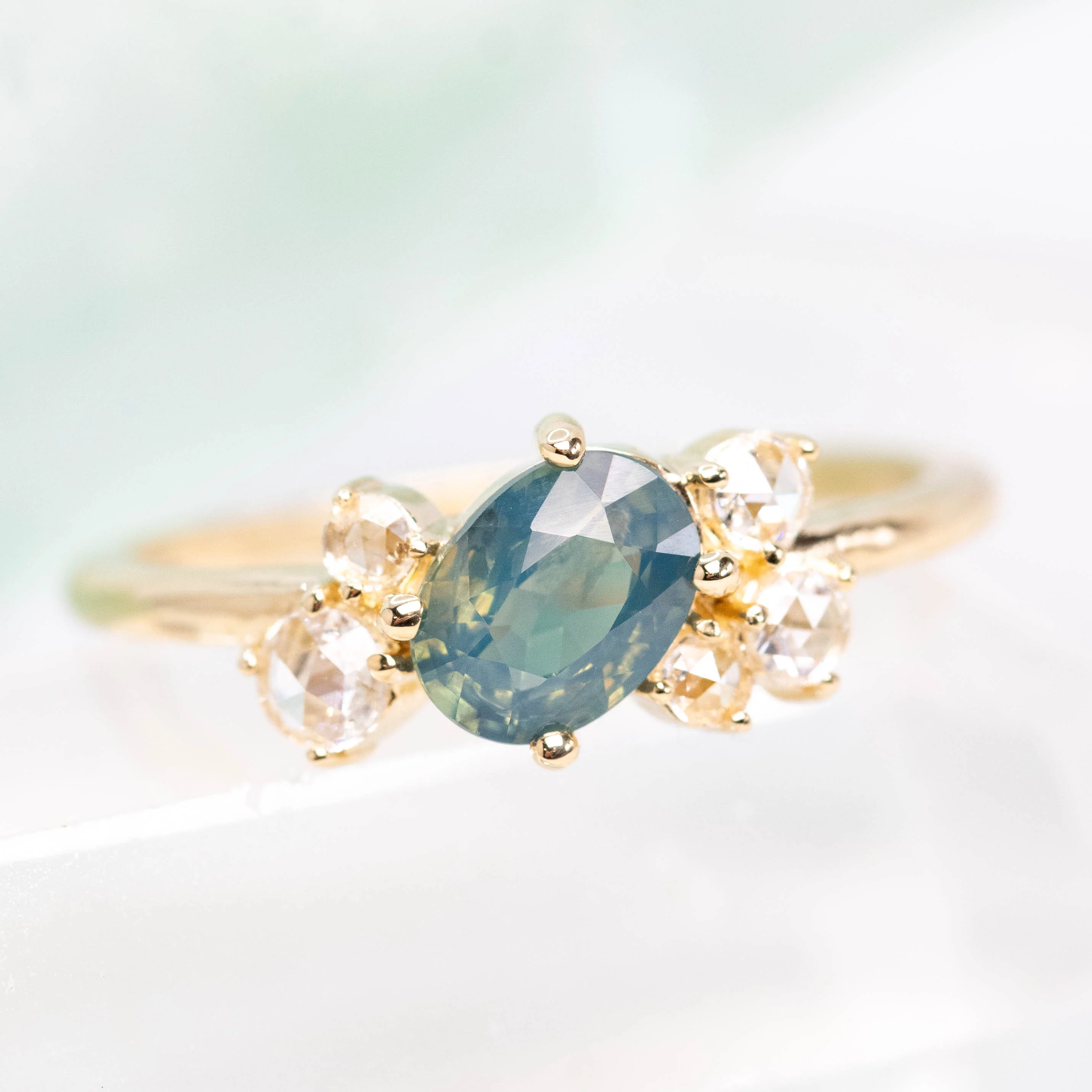 Lexus Ring with a 0.90 Carat Teal Oval Sapphire and Clear Diamond Accents in 10k Yellow Gold - Ready to Size and Ship - Image 8