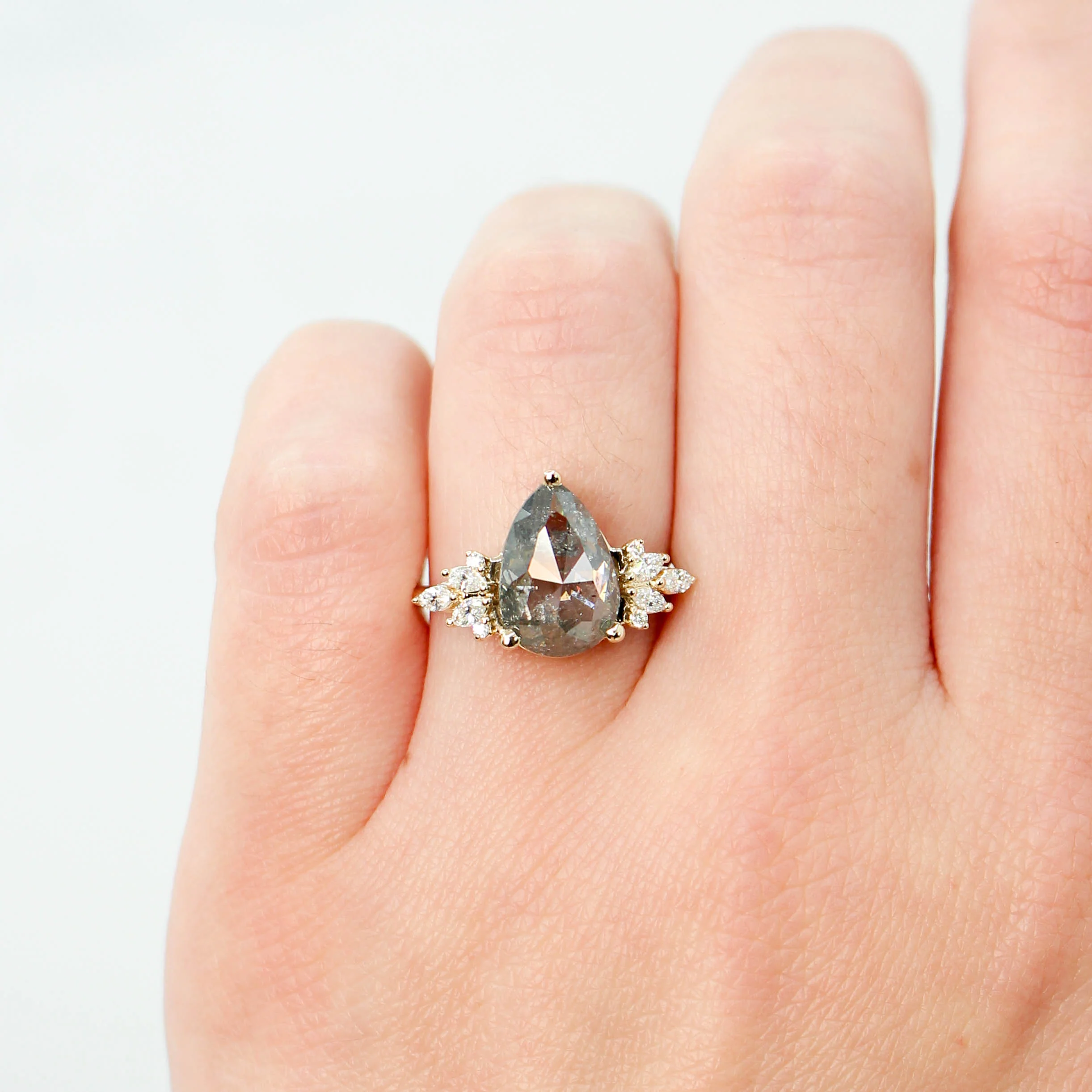 Project: Custom Odette Ring with a 3 Carat Dark and Clear Pear Salt and Pepper Diamond and White Accent Diamonds in 14k - Image 3
