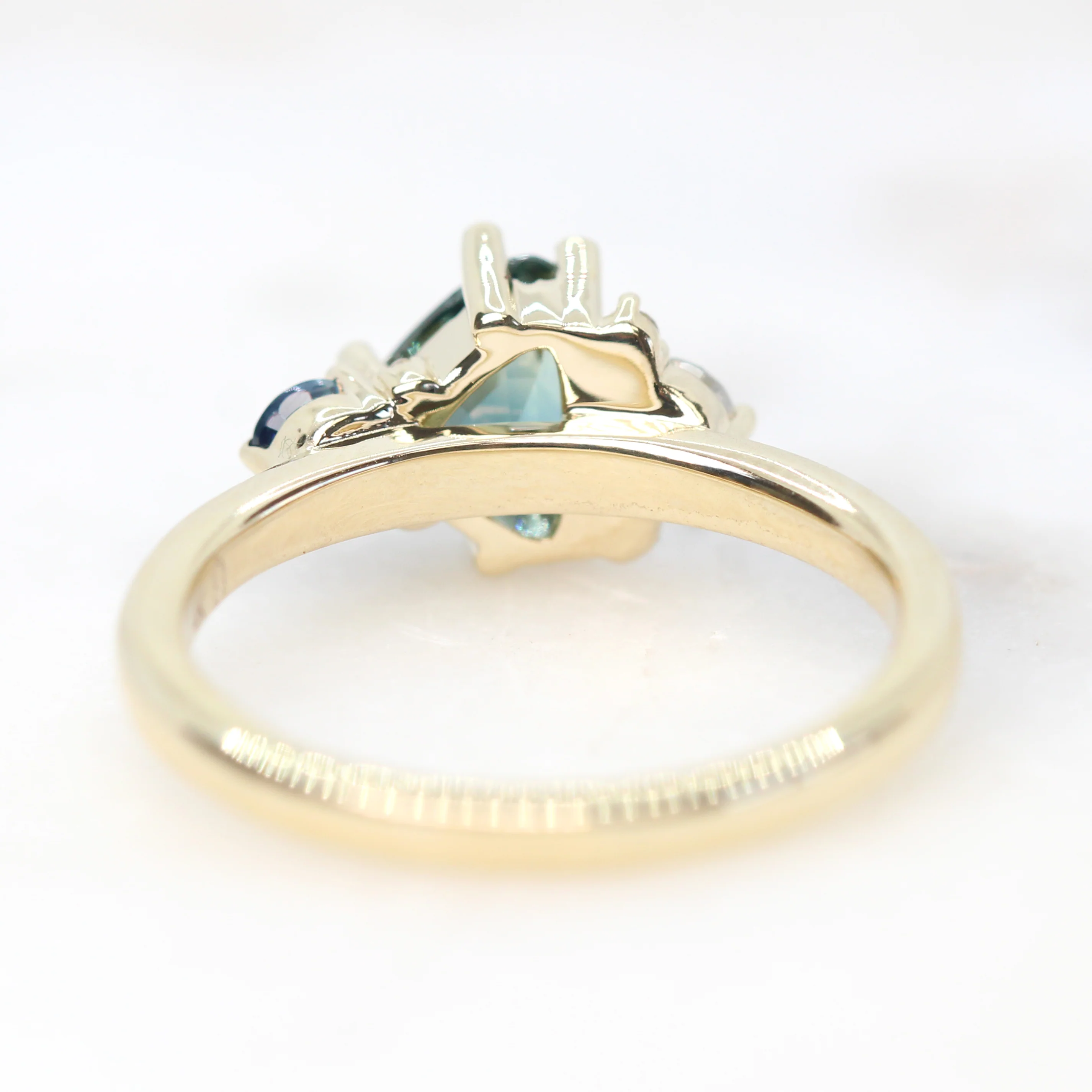 Project: Custom Serena Ring with a 1 Carat Teal Blue Trillion Sapphire and Asymmetrical Accent Diamonds in 14k - Image 3