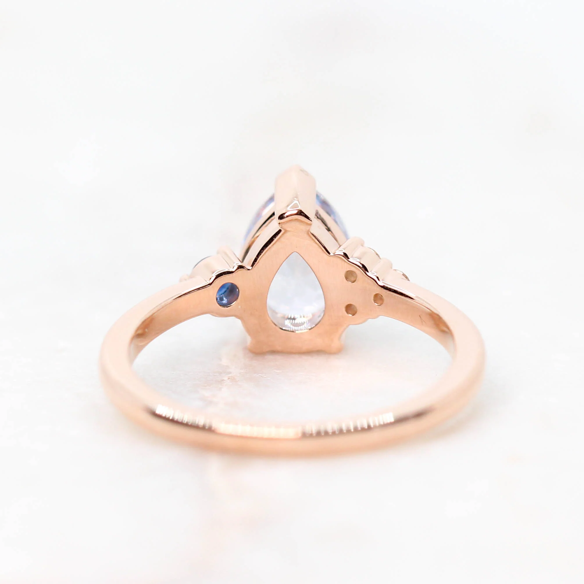Project: Custom Fletcher Ring with a 2 Carat Blue Pear Sapphire with White and Blue Sapphire Accents in 14k - Image 10