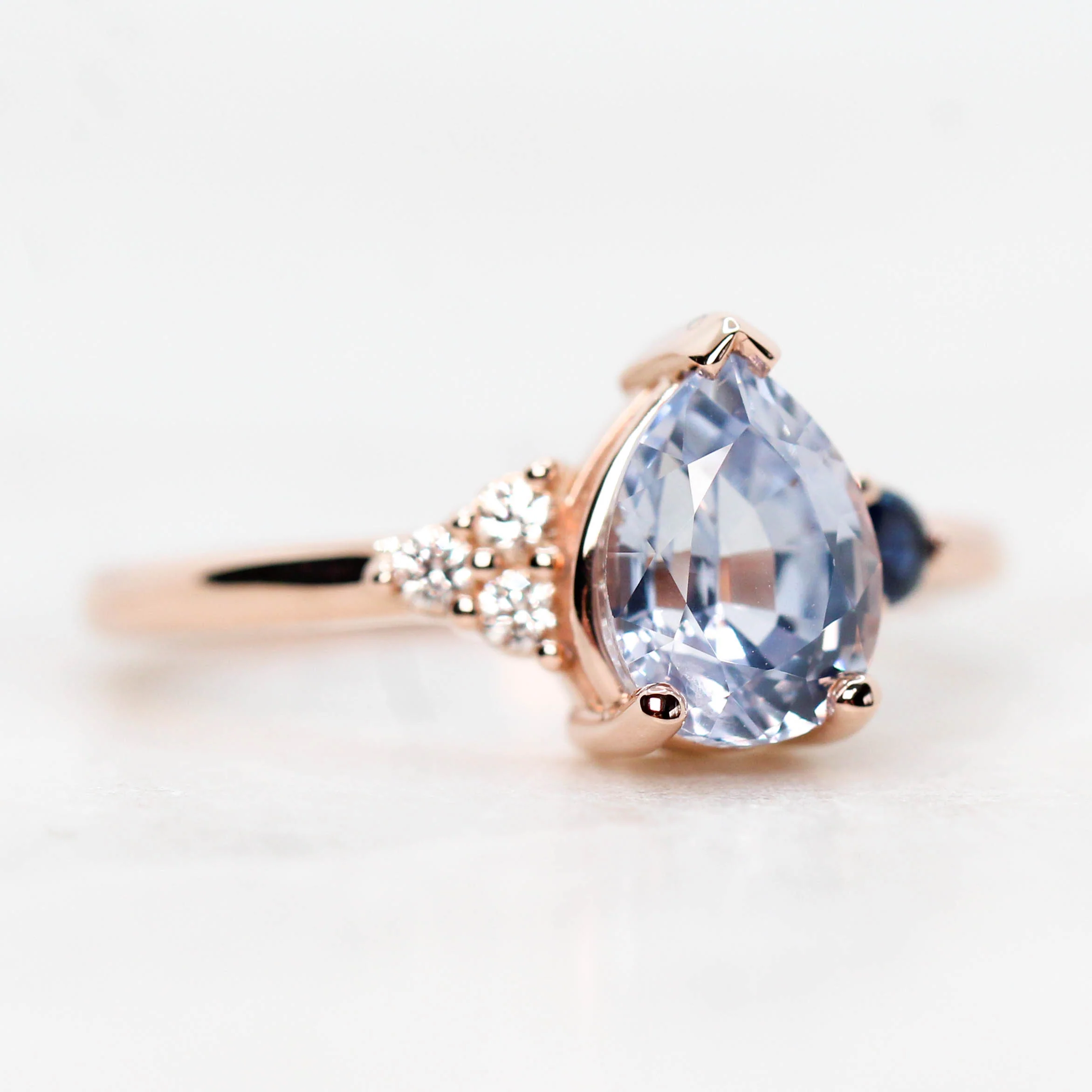Project: Custom Fletcher Ring with a 2 Carat Blue Pear Sapphire with White and Blue Sapphire Accents in 14k - Image 4