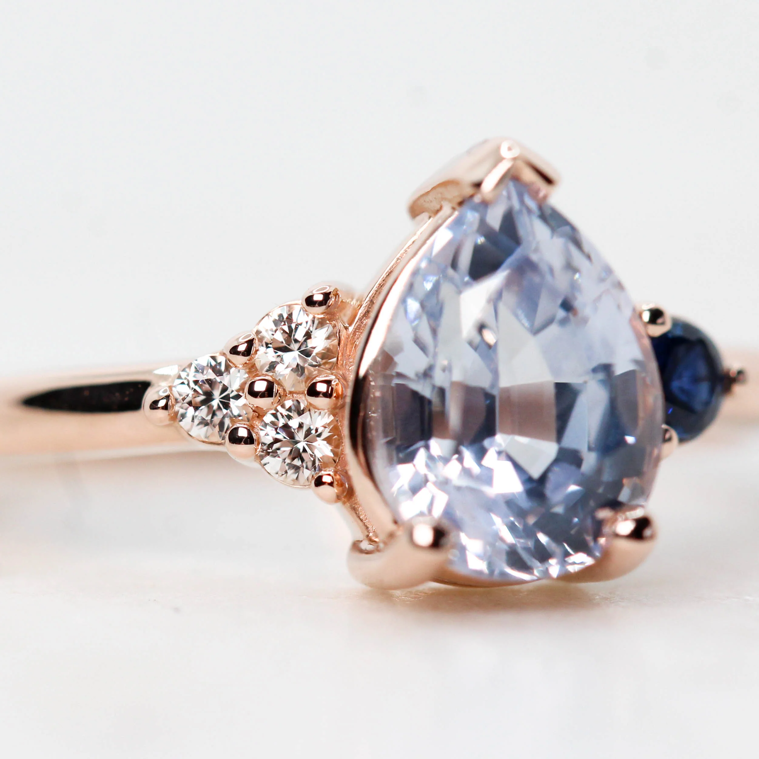 Project: Custom Fletcher Ring with a 2 Carat Blue Pear Sapphire with White and Blue Sapphire Accents in 14k - Image 5