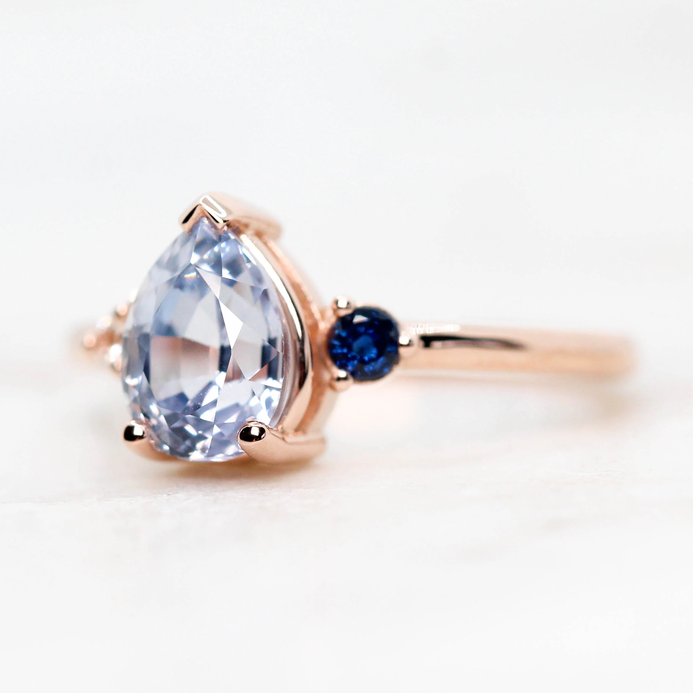 Project: Custom Fletcher Ring with a 2 Carat Blue Pear Sapphire with White and Blue Sapphire Accents in 14k - Image 6