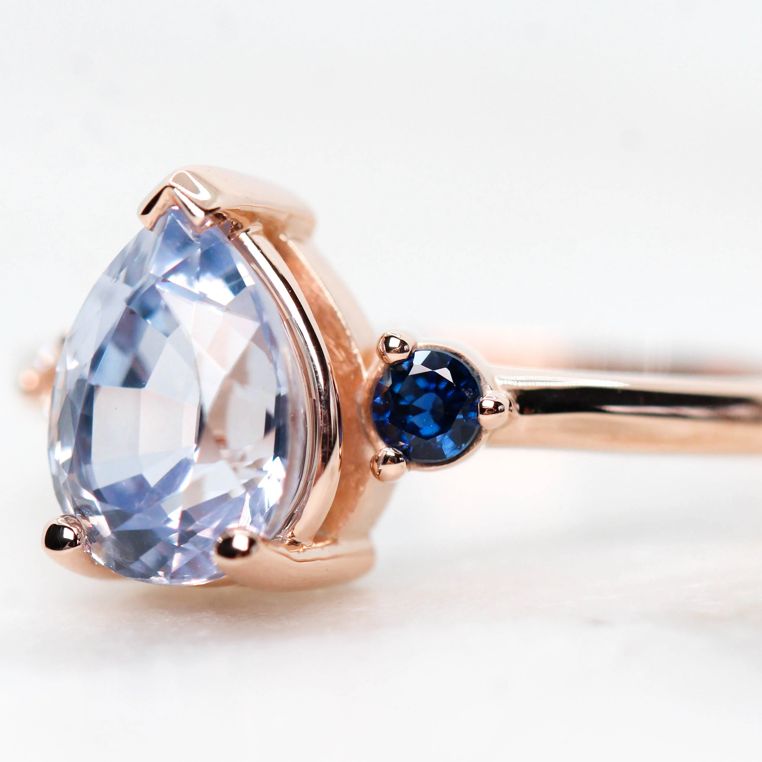 Project: Custom Fletcher Ring with a 2 Carat Blue Pear Sapphire with White and Blue Sapphire Accents in 14k - Image 7