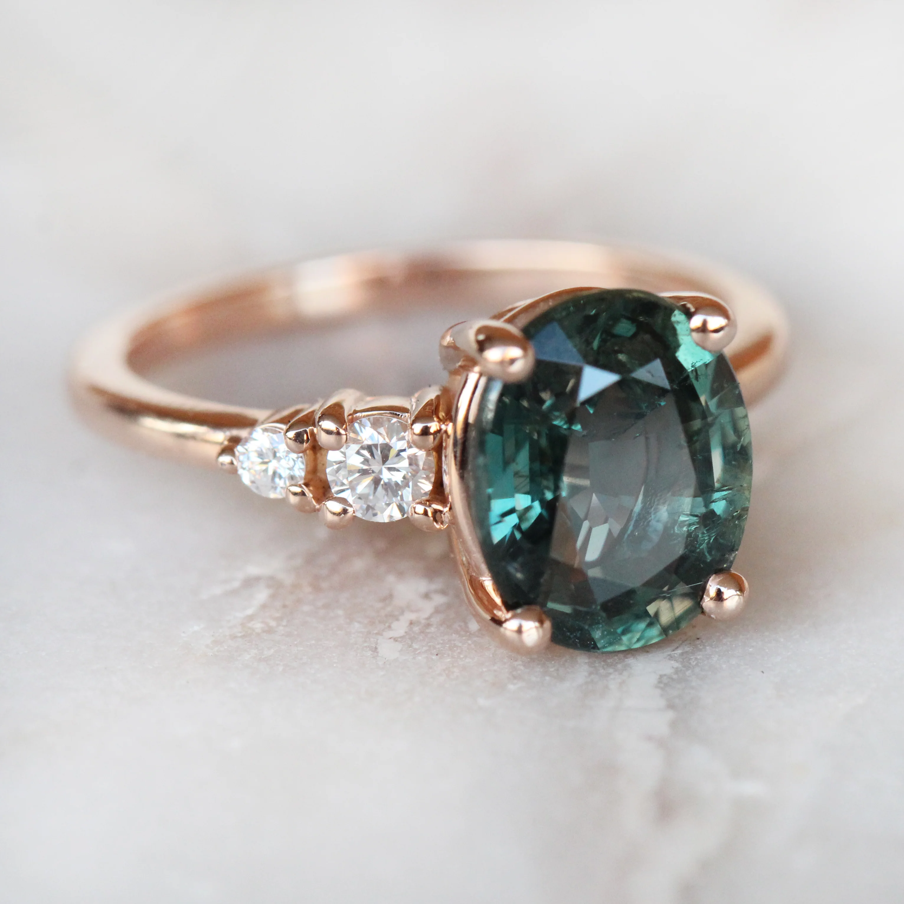 Project: Custom Jesse Ring with 3 Carat Teal Blue Sapphire with Asymmetrical Accent Diamonds in 14k - Image 3