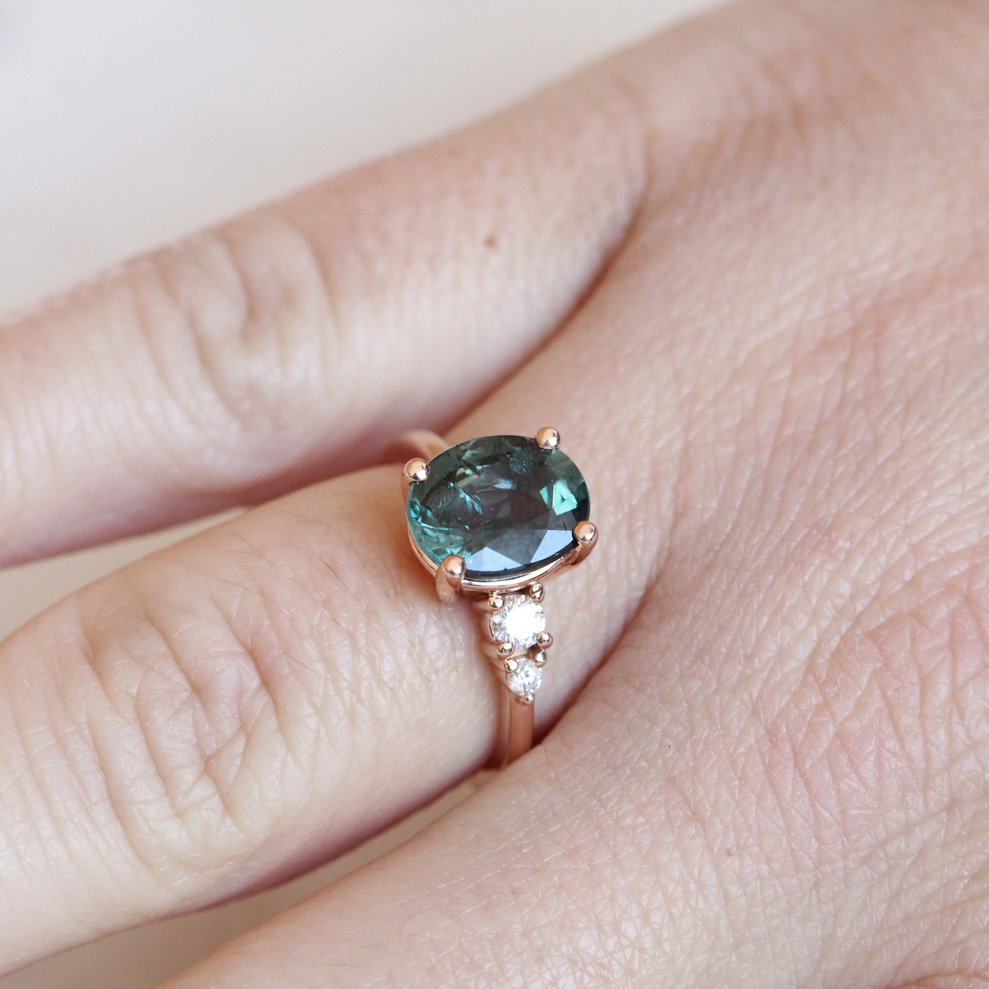 Project: Custom Jesse Ring with 3 Carat Teal Blue Sapphire with Asymmetrical Accent Diamonds in 14k - Image 4