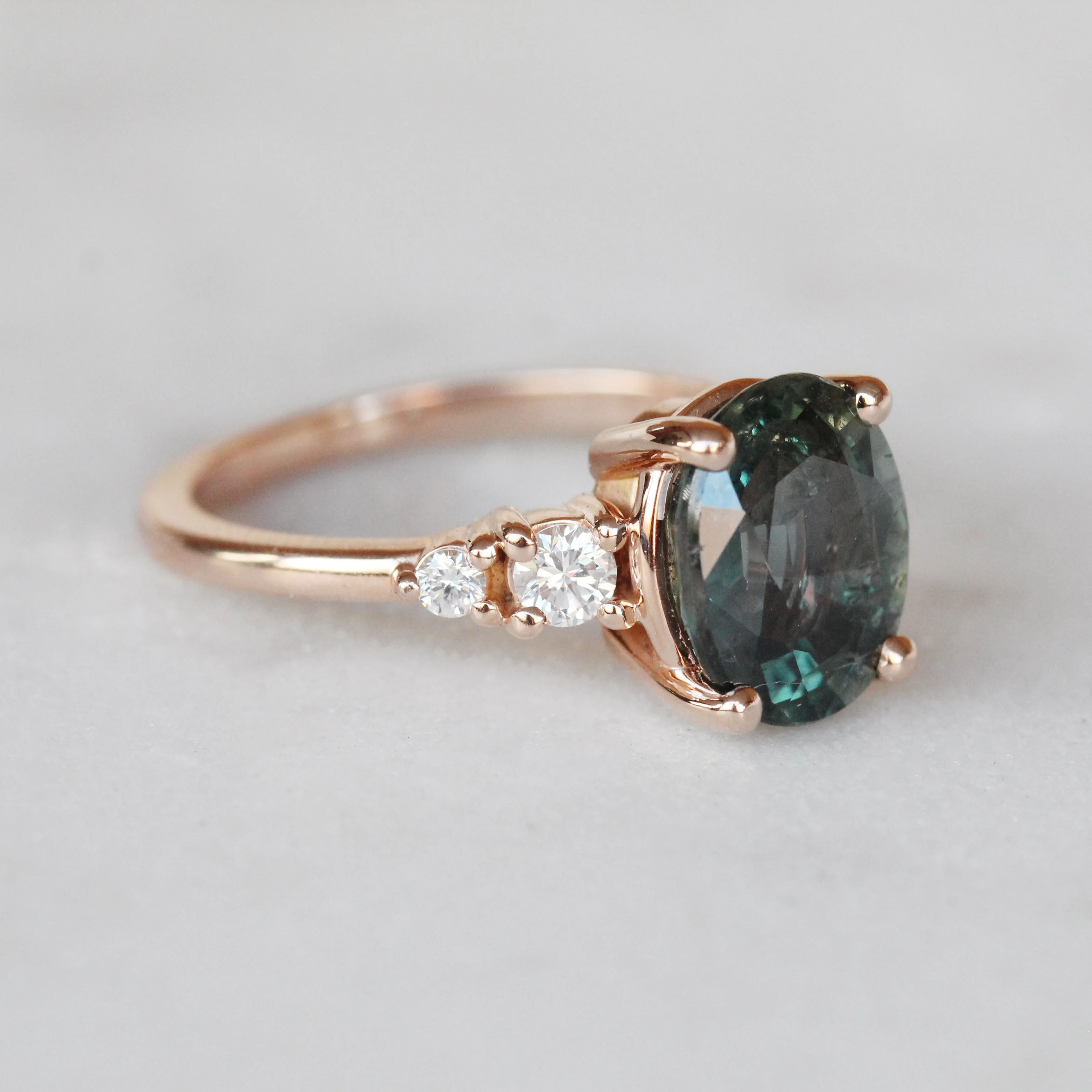 Project: Custom Jesse Ring with 3 Carat Teal Blue Sapphire with Asymmetrical Accent Diamonds in 14k - Image 6