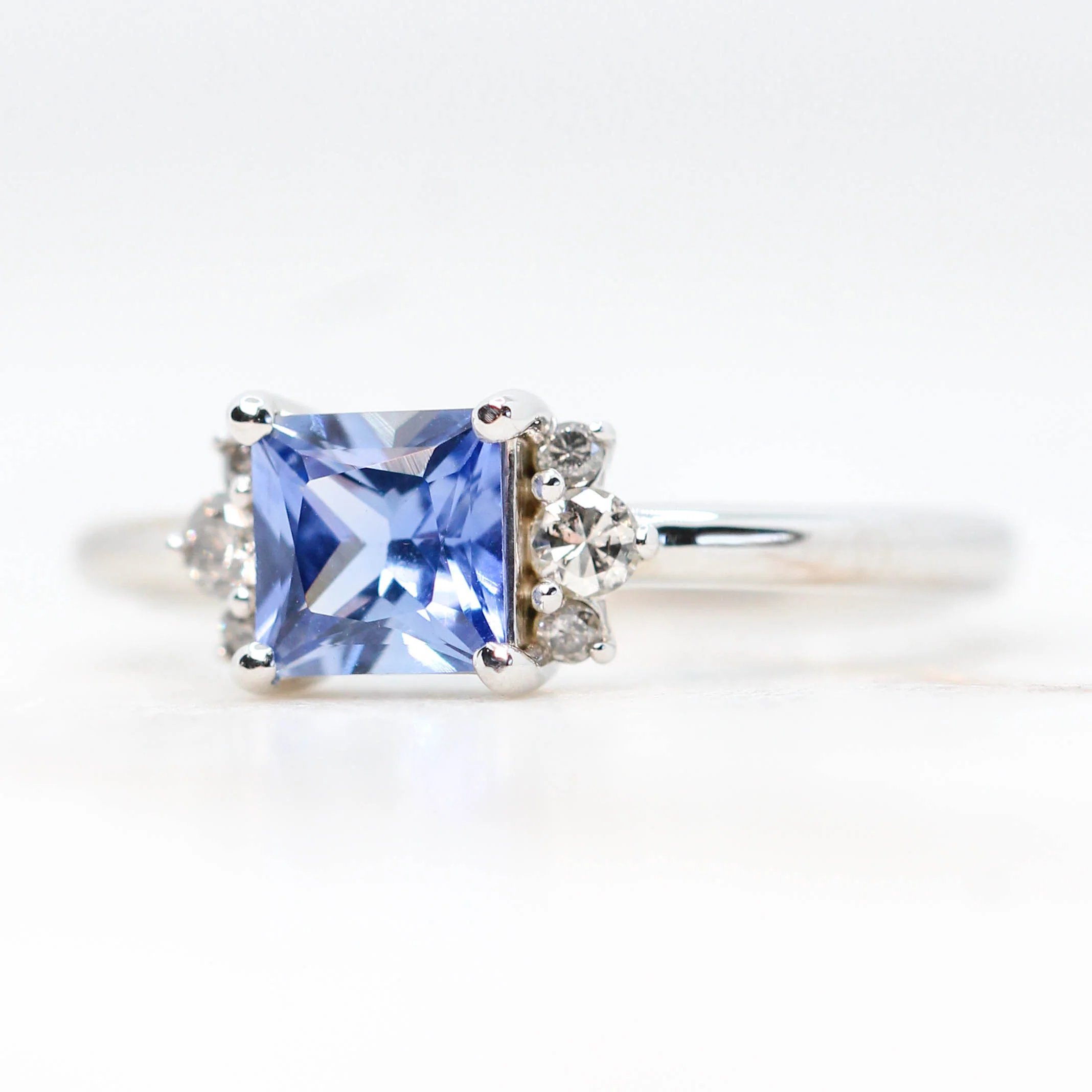 Project: Custom Loren Ring with a 1 Carat Princess Cut Blue Sapphire and White Accent Diamonds in 14k - Image 3