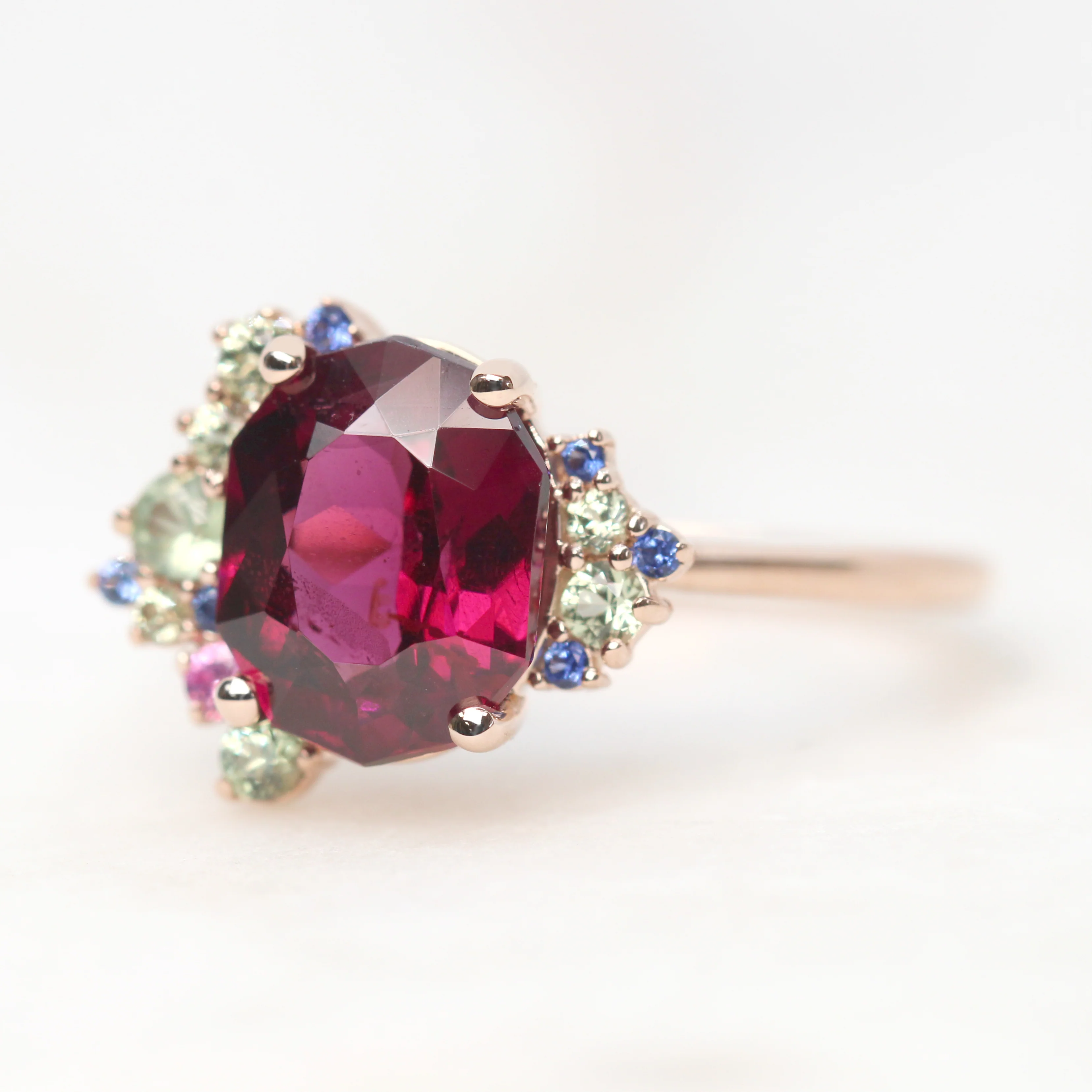 Project: Custom Orion Ring with a 3 Carat Geometric Oval Cut Garnet and Multicolor Sapphire Accents in 14k - Image 3