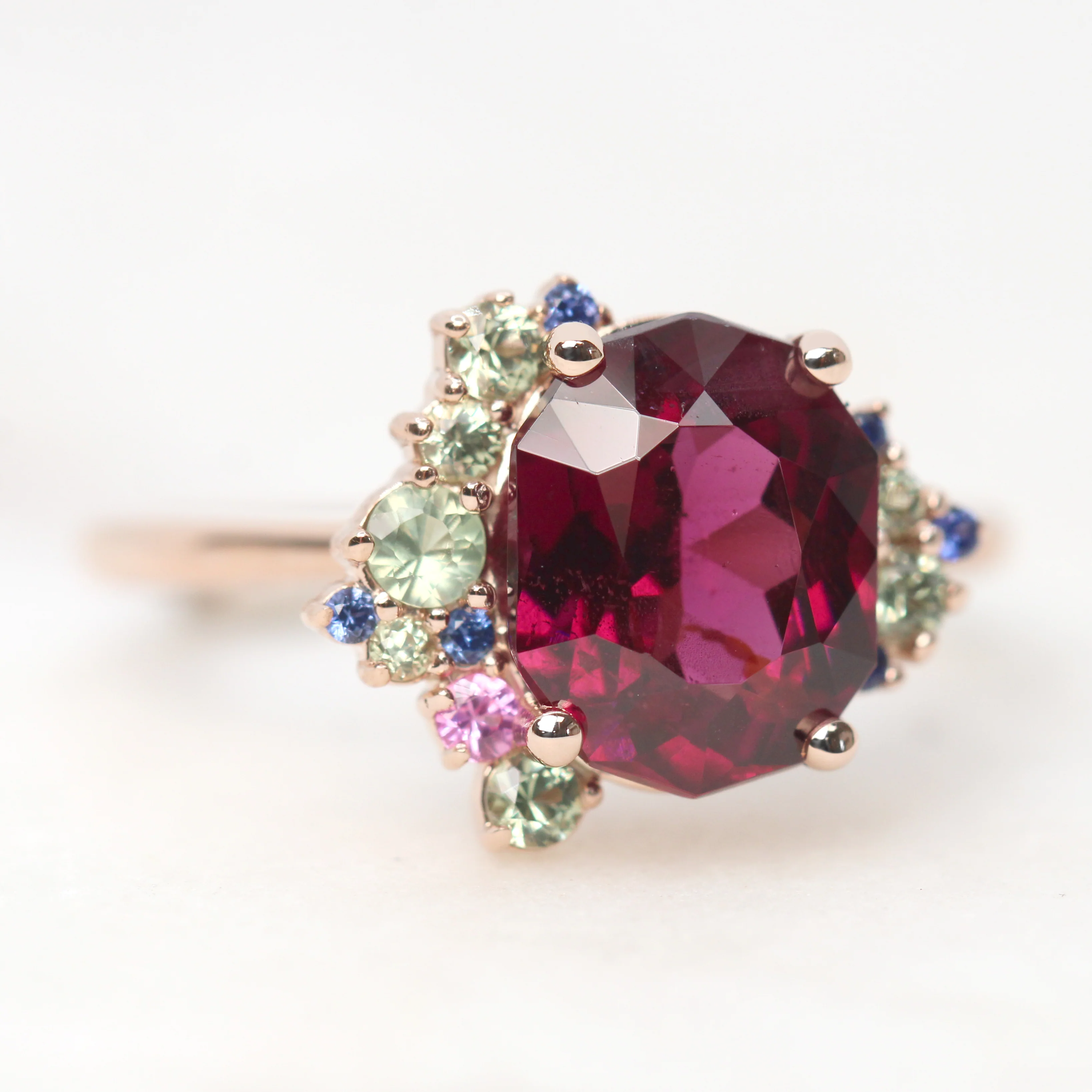 Project: Custom Orion Ring with a 3 Carat Geometric Oval Cut Garnet and Multicolor Sapphire Accents in 14k - Image 4
