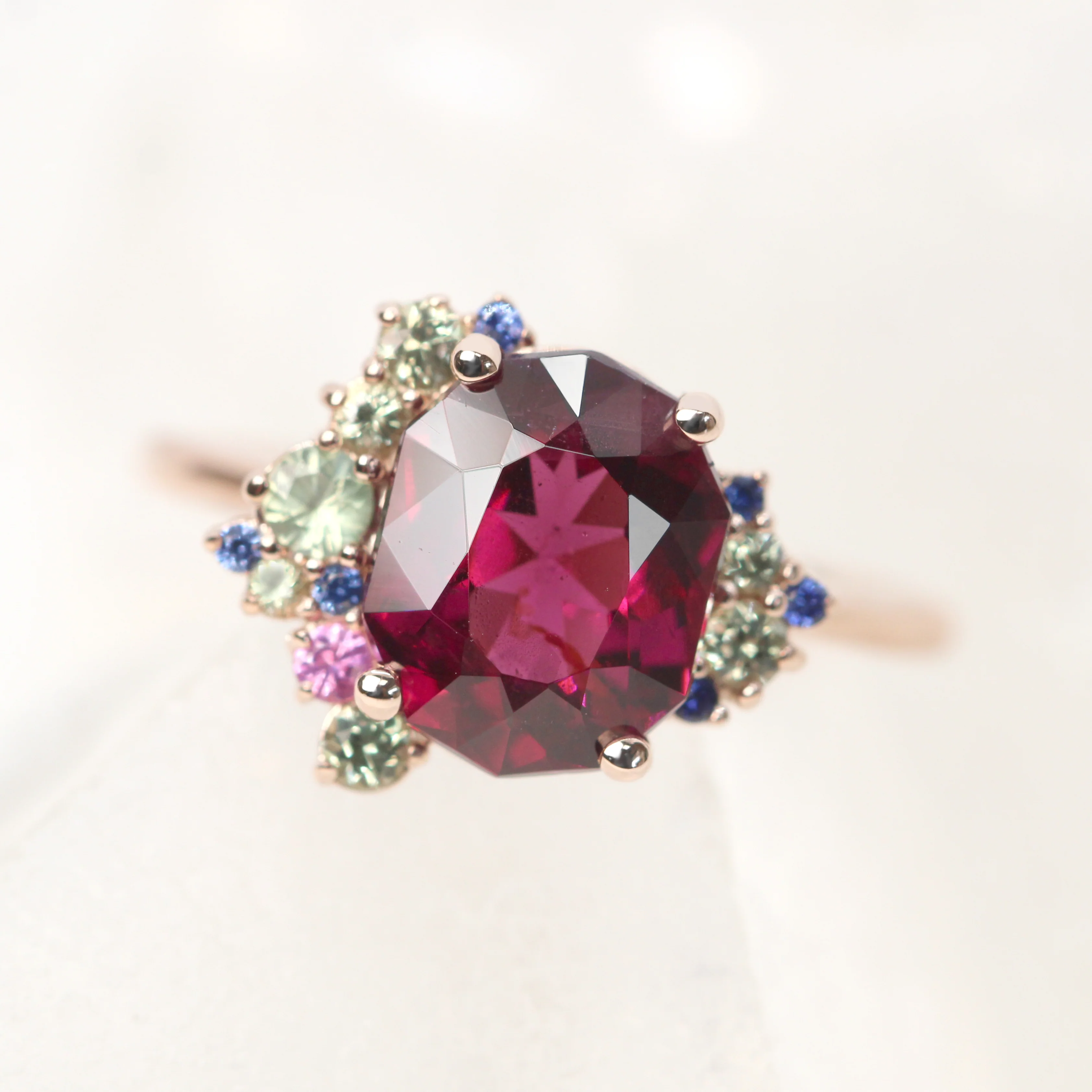 Project: Custom Orion Ring with a 3 Carat Geometric Oval Cut Garnet and Multicolor Sapphire Accents in 14k - Image 7