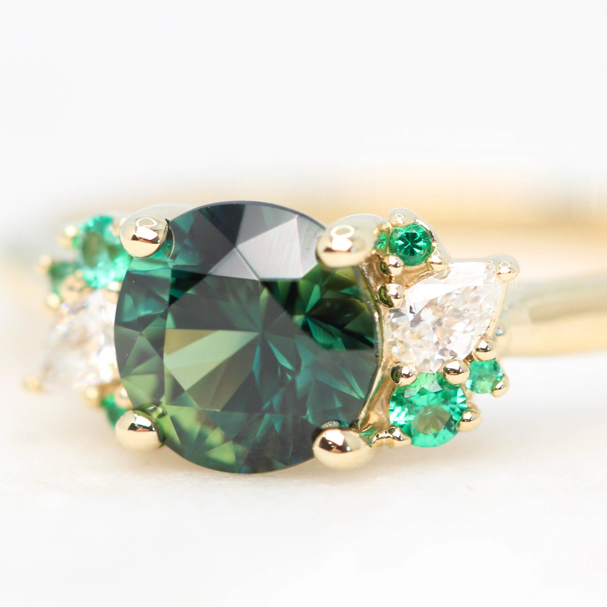 Project: Custom Sable Ring with a 1.5 Carat Round Sapphire with Emerald and Diamond Accents in 14k