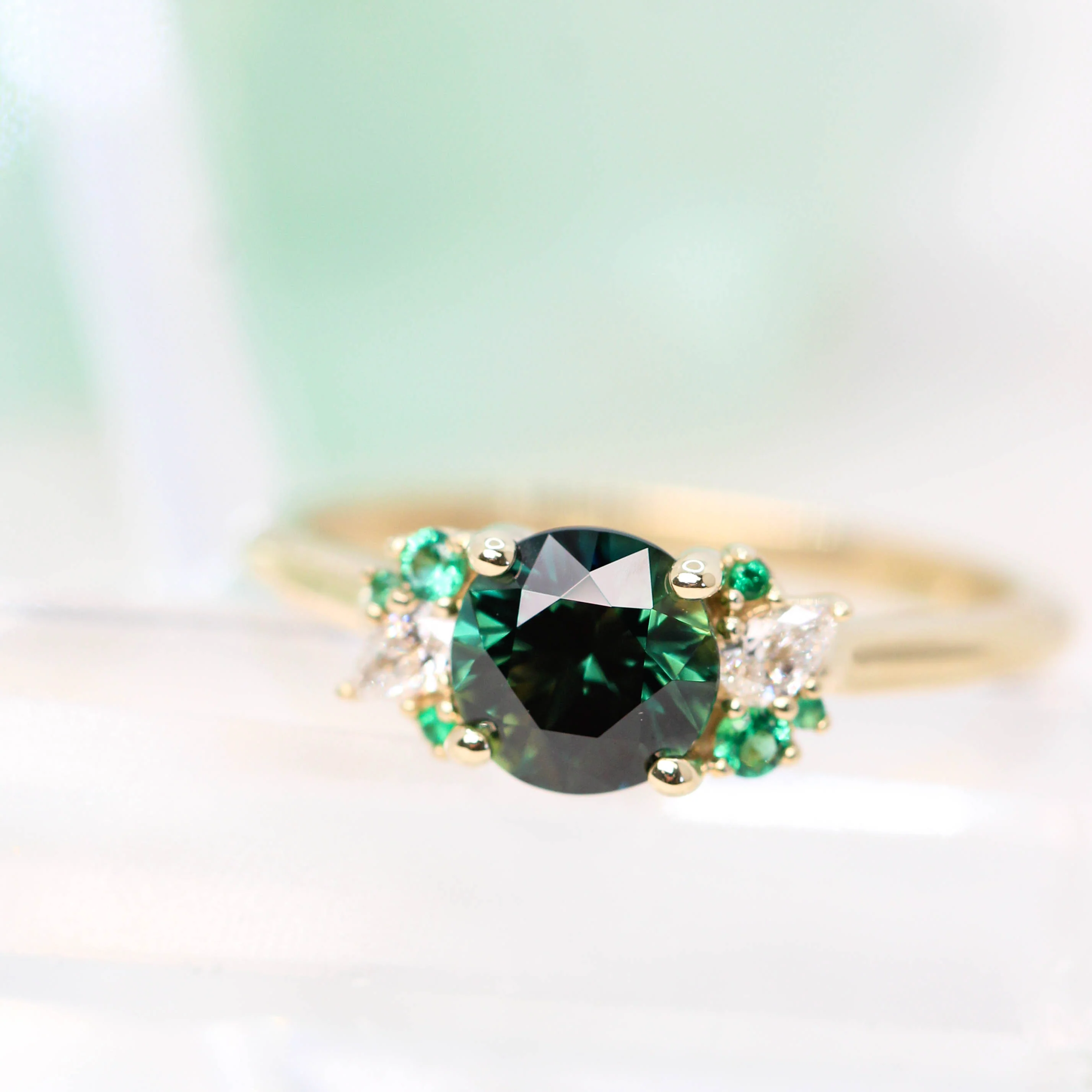 Project: Custom Sable Ring with a 1.5 Carat Round Sapphire with Emerald and Diamond Accents in 14k - Image 10