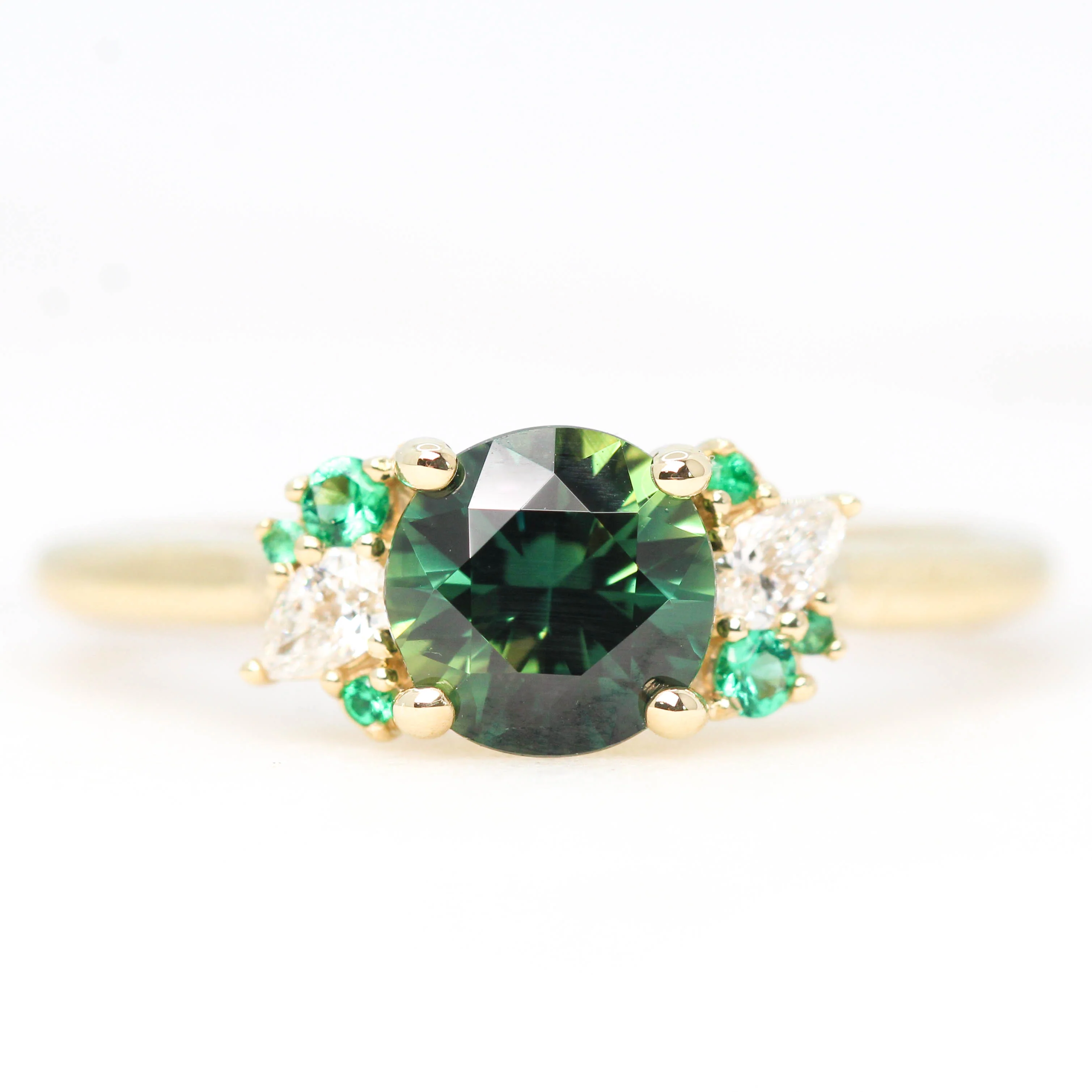 Project: Custom Sable Ring with a 1.5 Carat Round Sapphire with Emerald and Diamond Accents in 14k - Image 2
