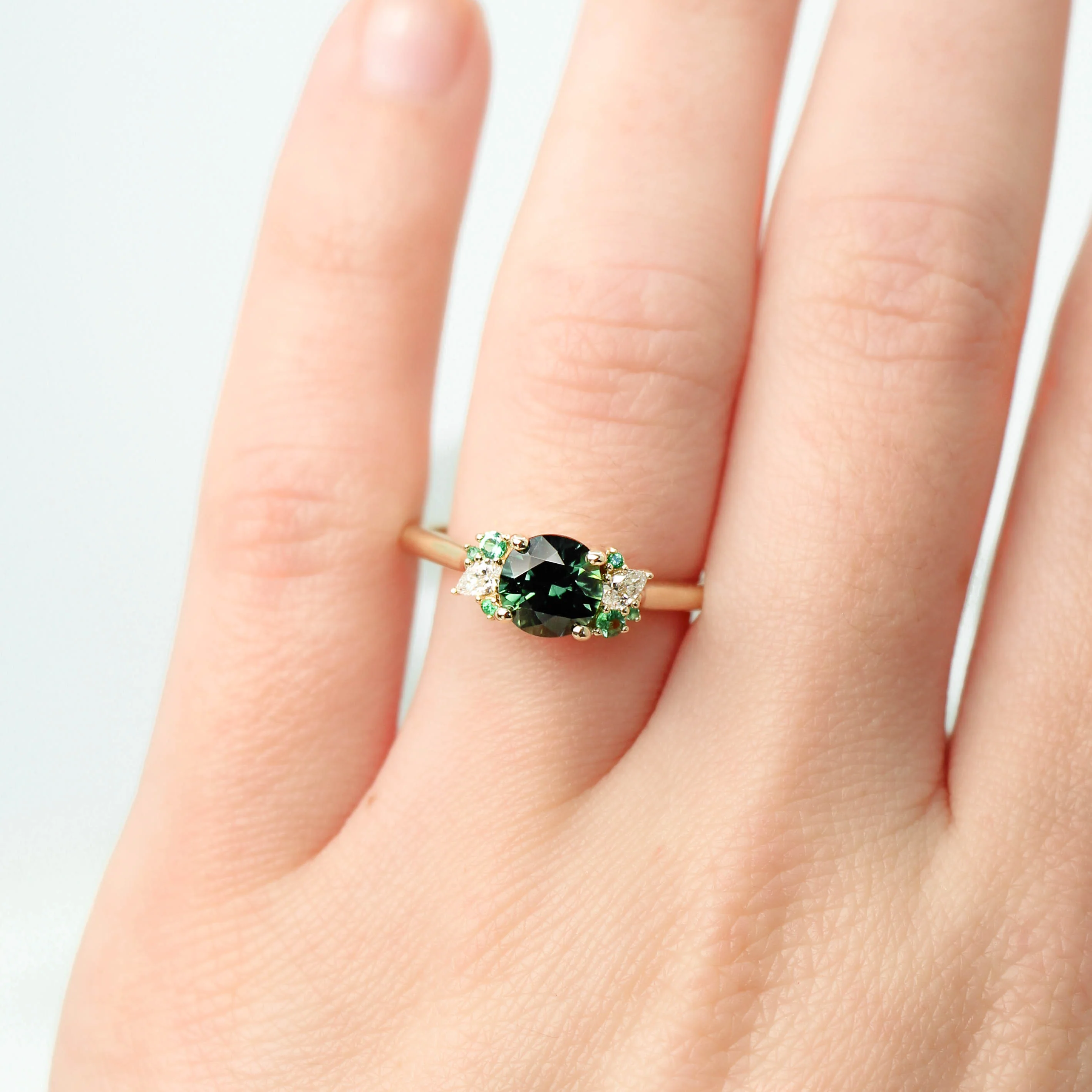 Project: Custom Sable Ring with a 1.5 Carat Round Sapphire with Emerald and Diamond Accents in 14k - Image 3