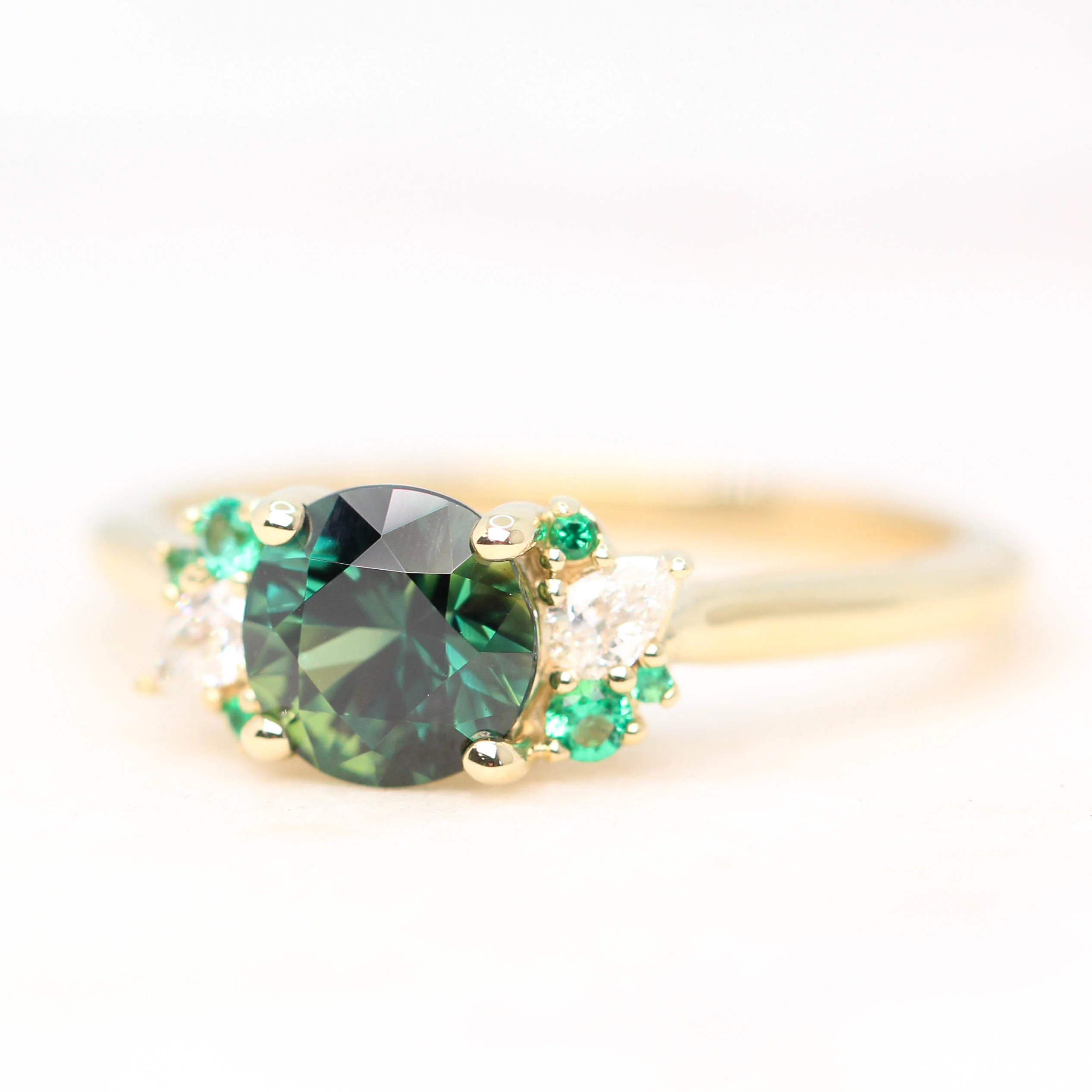 Project: Custom Sable Ring with a 1.5 Carat Round Sapphire with Emerald and Diamond Accents in 14k - Image 4