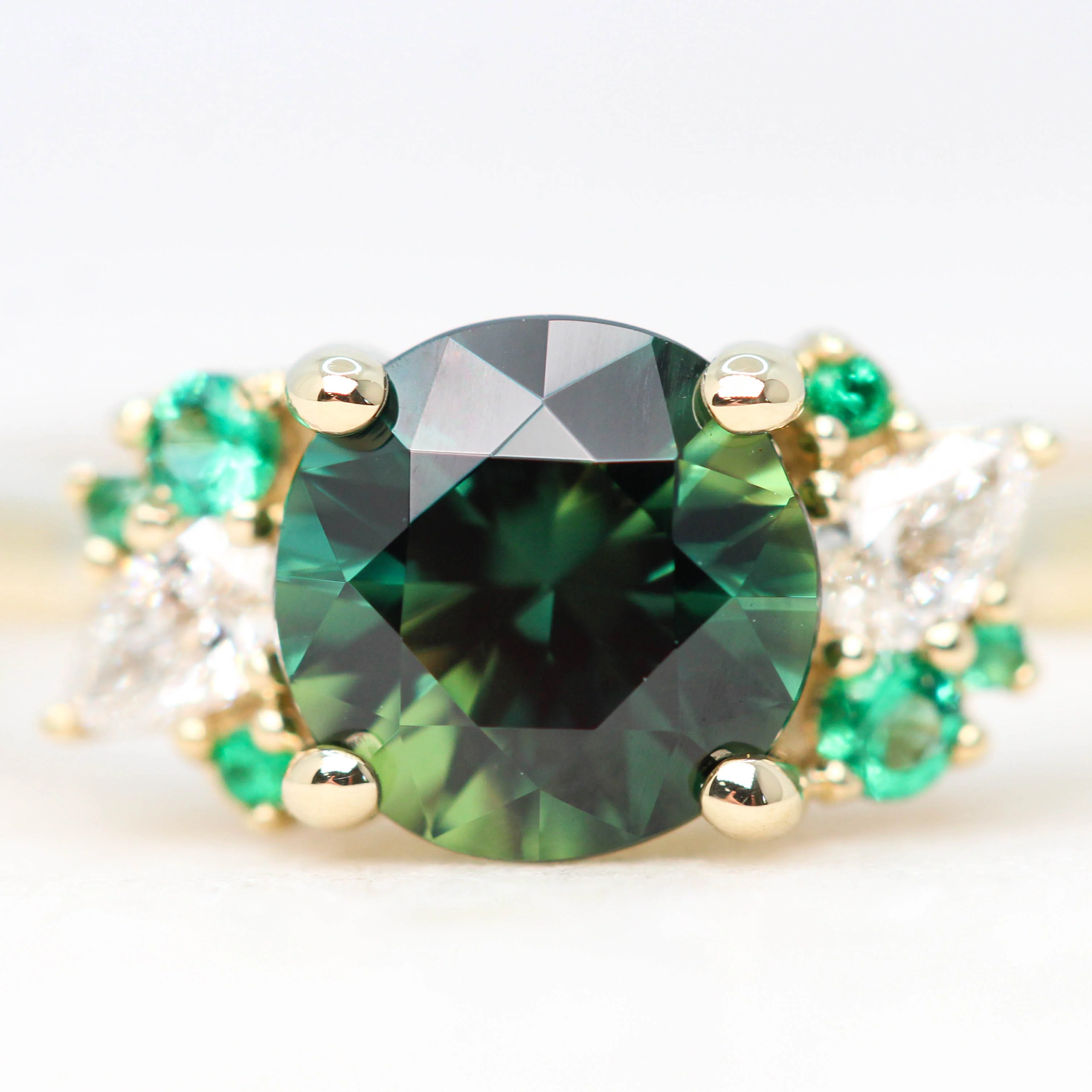 Project: Custom Sable Ring with a 1.5 Carat Round Sapphire with Emerald and Diamond Accents in 14k - Image 8