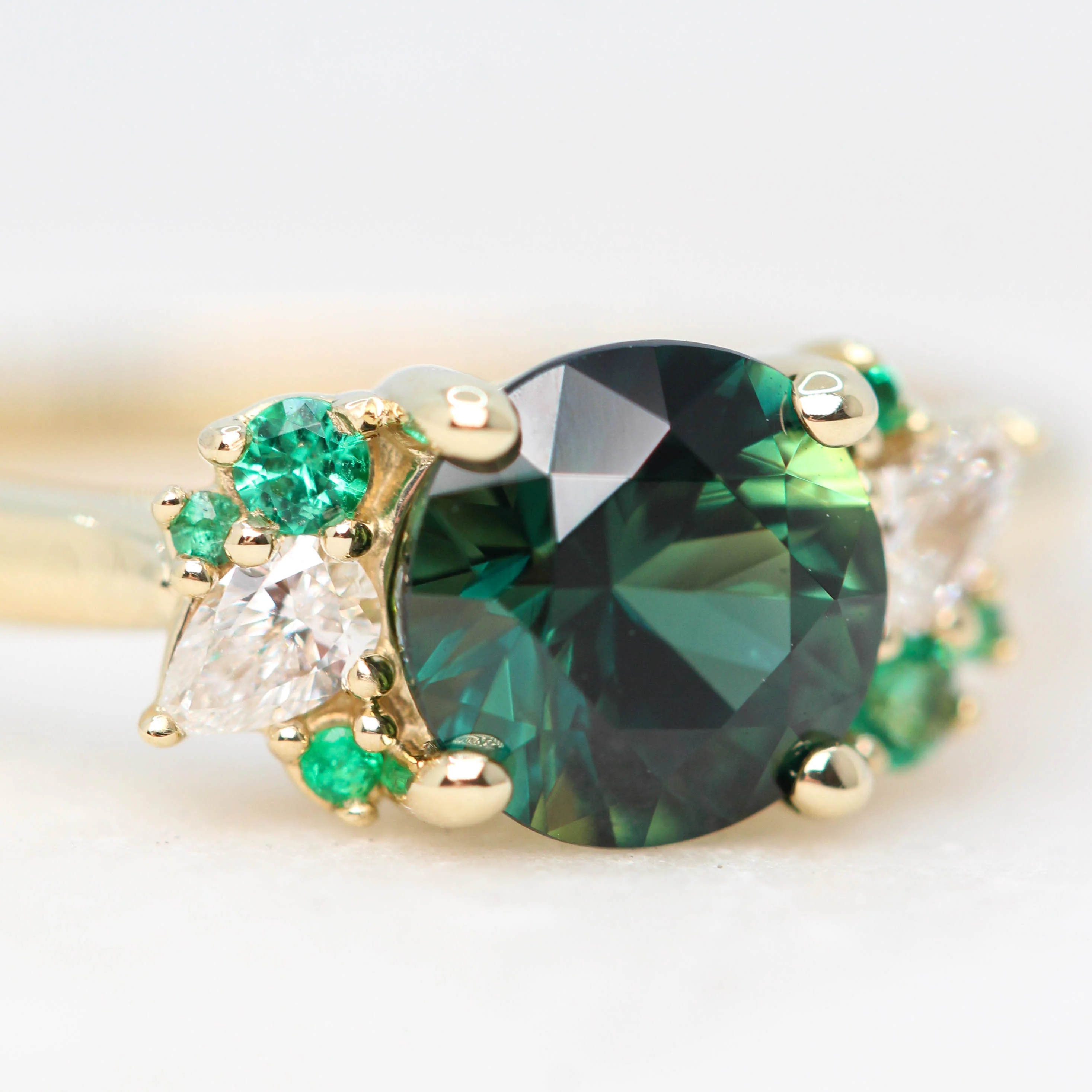 Project: Custom Sable Ring with a 1.5 Carat Round Sapphire with Emerald and Diamond Accents in 14k - Image 9