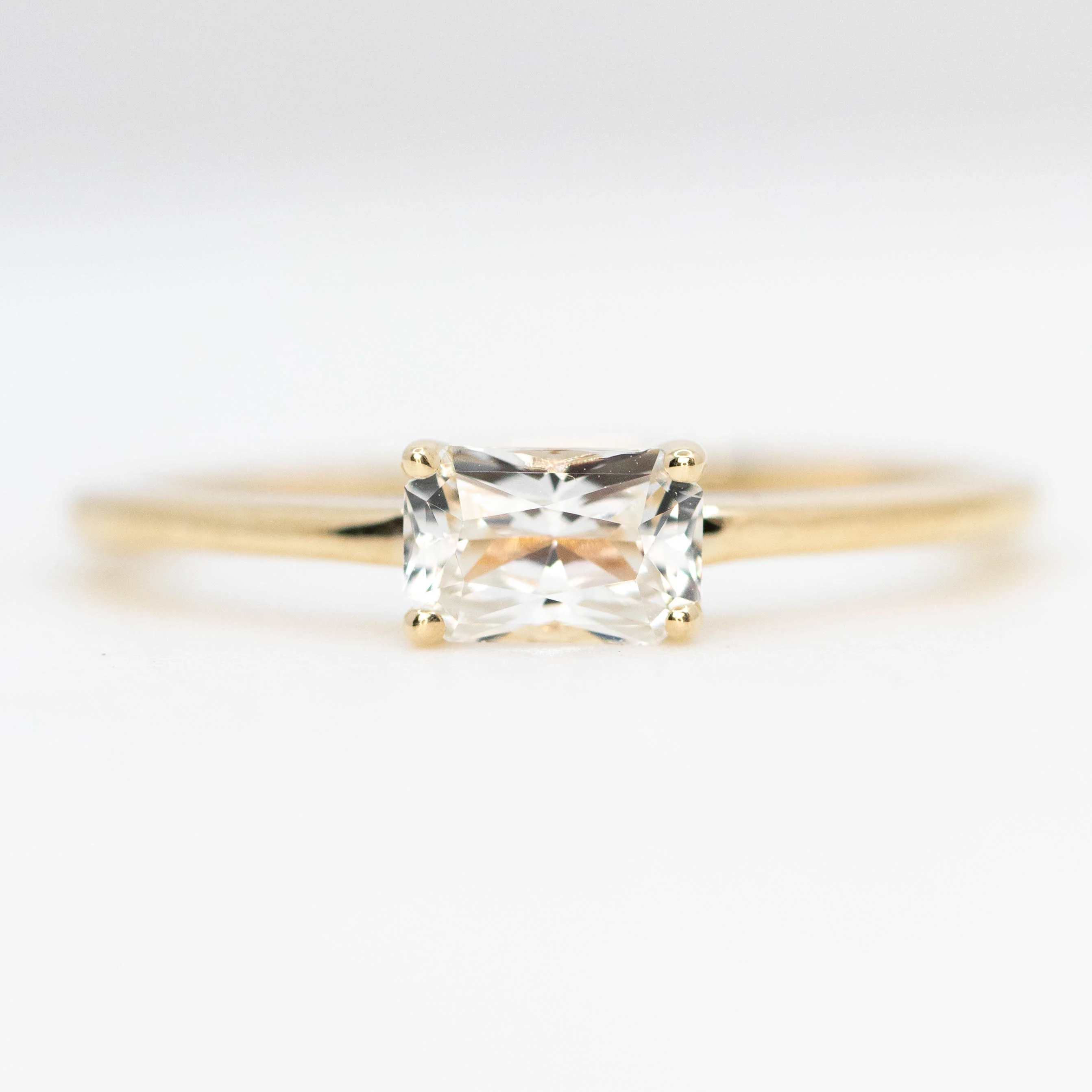 Ruthie Ring with a 0.75 Carat Radiant Cut White Sapphire in 10k Yellow Gold - Ready to Size and Ship