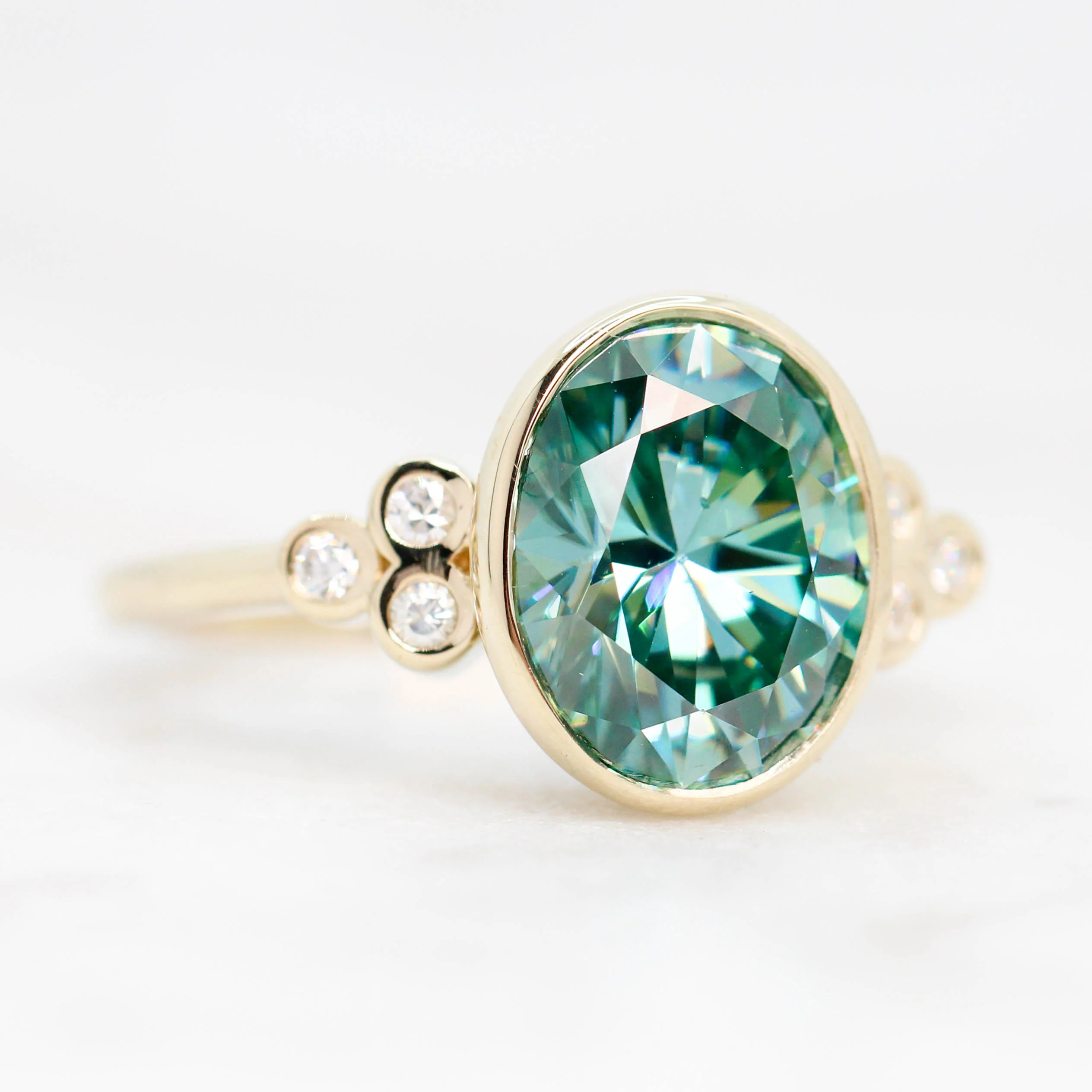Project: Custom Sophia Ring with a 2.5 Carat Bezel Set Teal Oval Moissanite and Accent Diamonds in 14k - Image 5